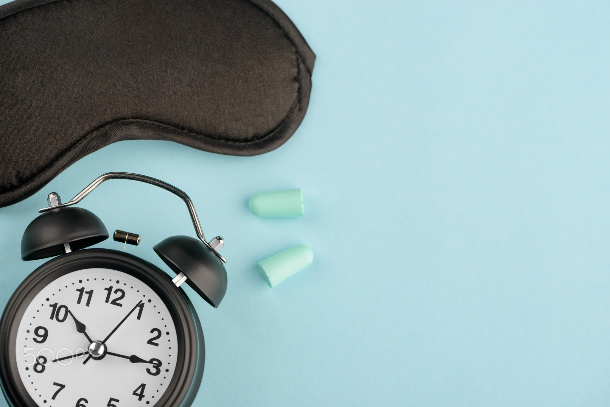 Clock, eye mask and earplugs