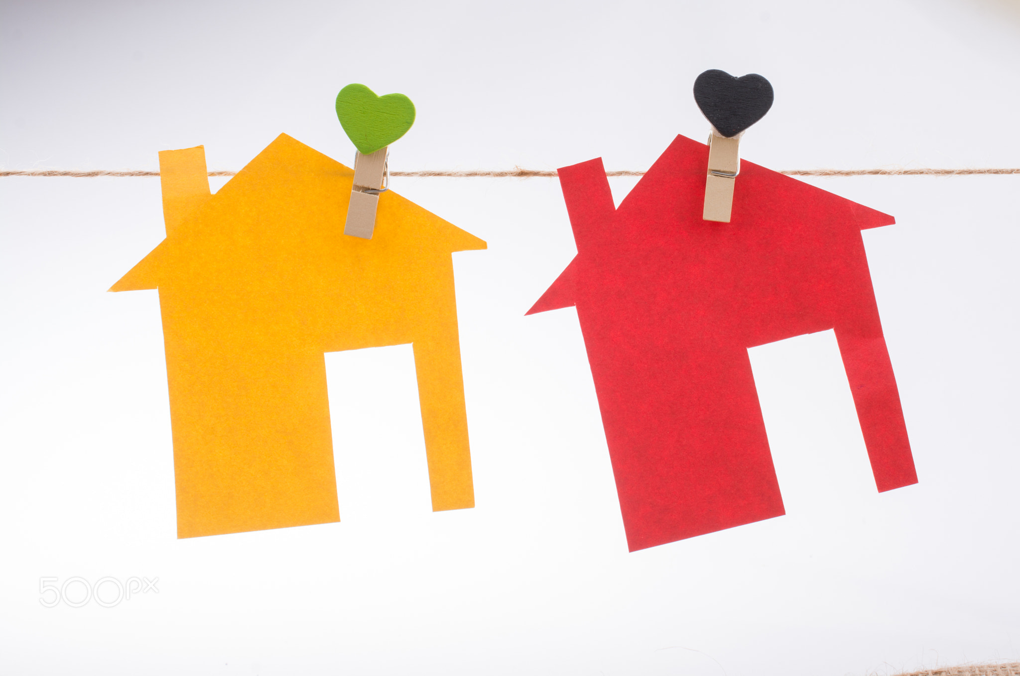 Little colorful paper houses attached on a string