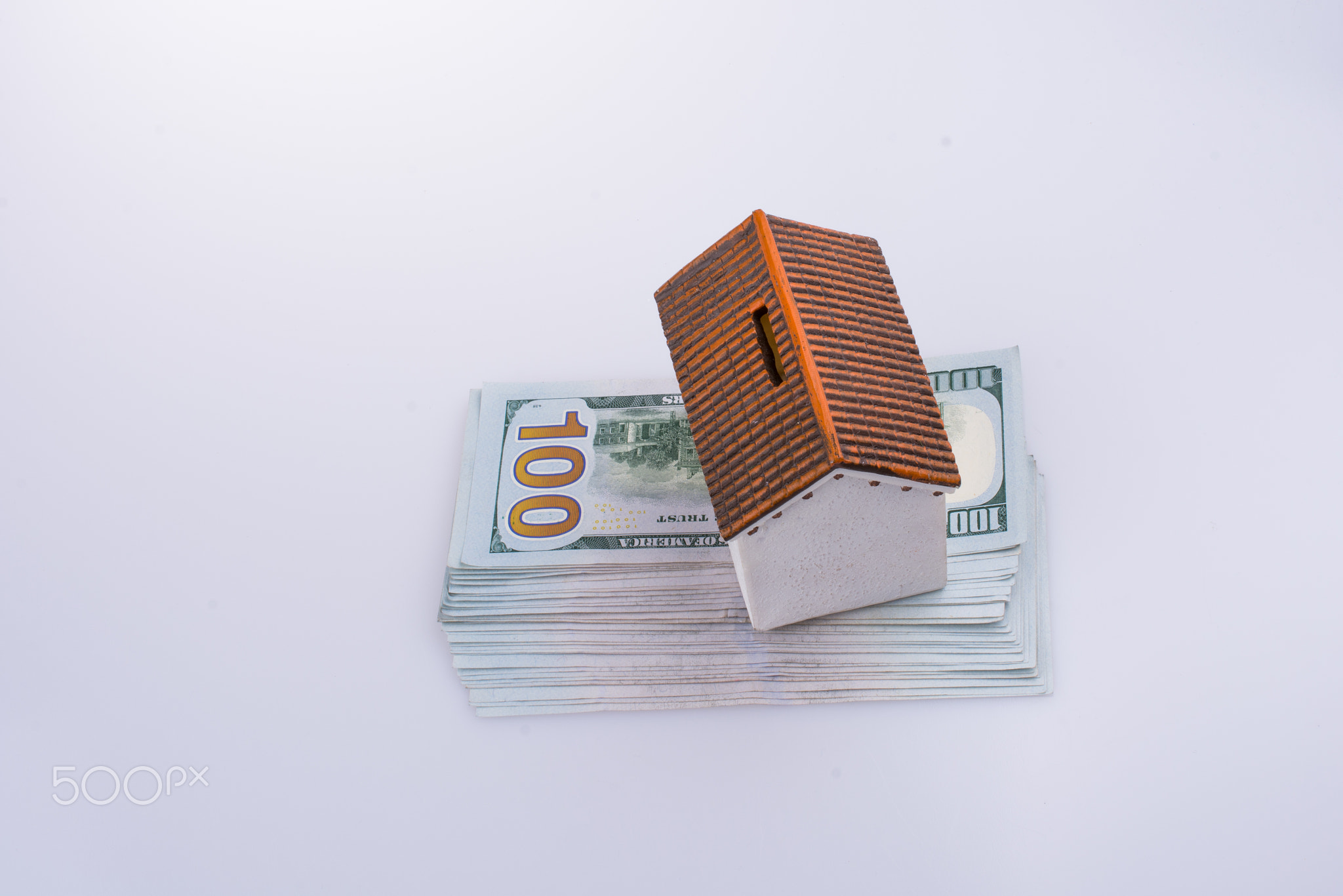 Model house placed on the American dollar banknotes