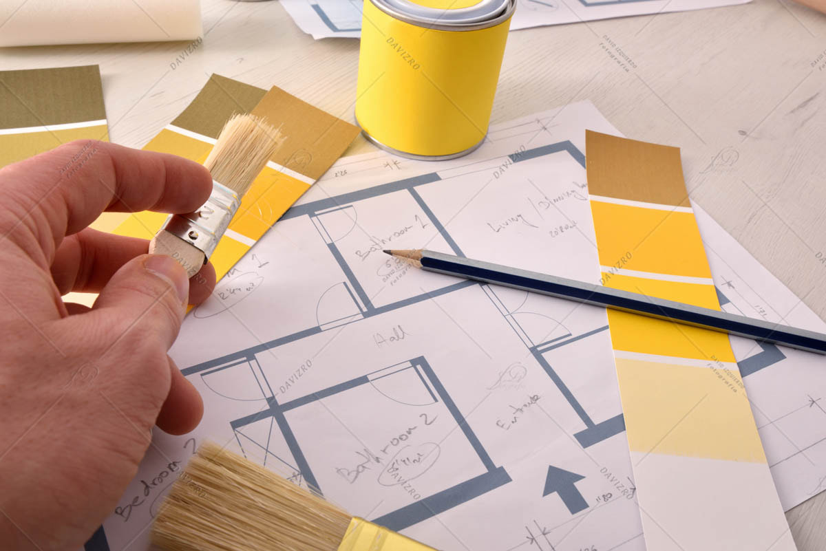 Designer working on interior home painting project elevated view