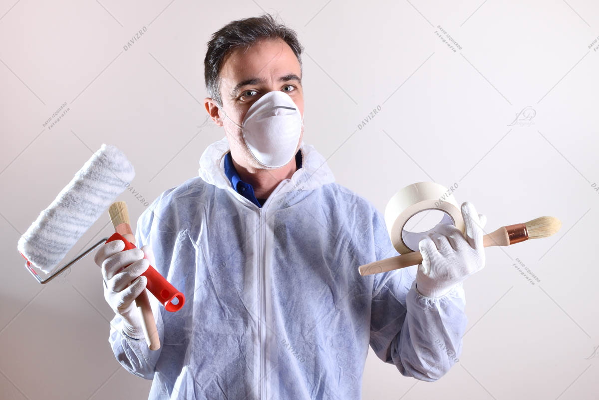 Background with professional painter with working overalls