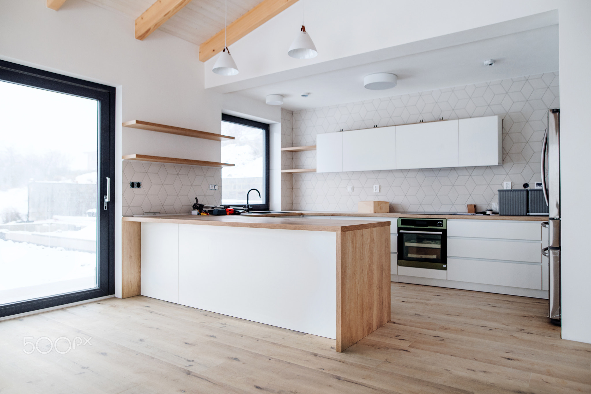 A mature man with his senior father furnishing new house, a new home concept.