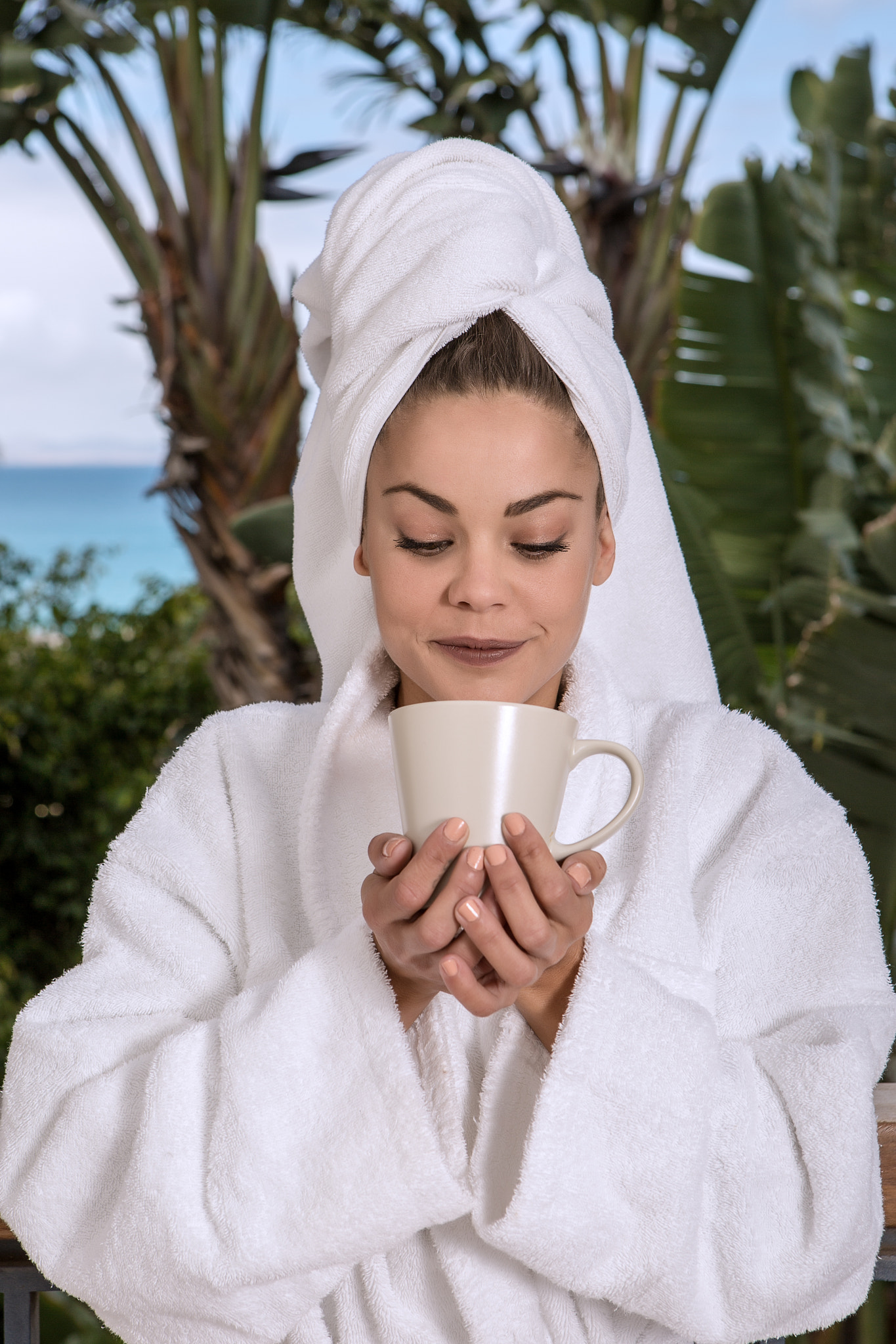 Woman having coffee after shower