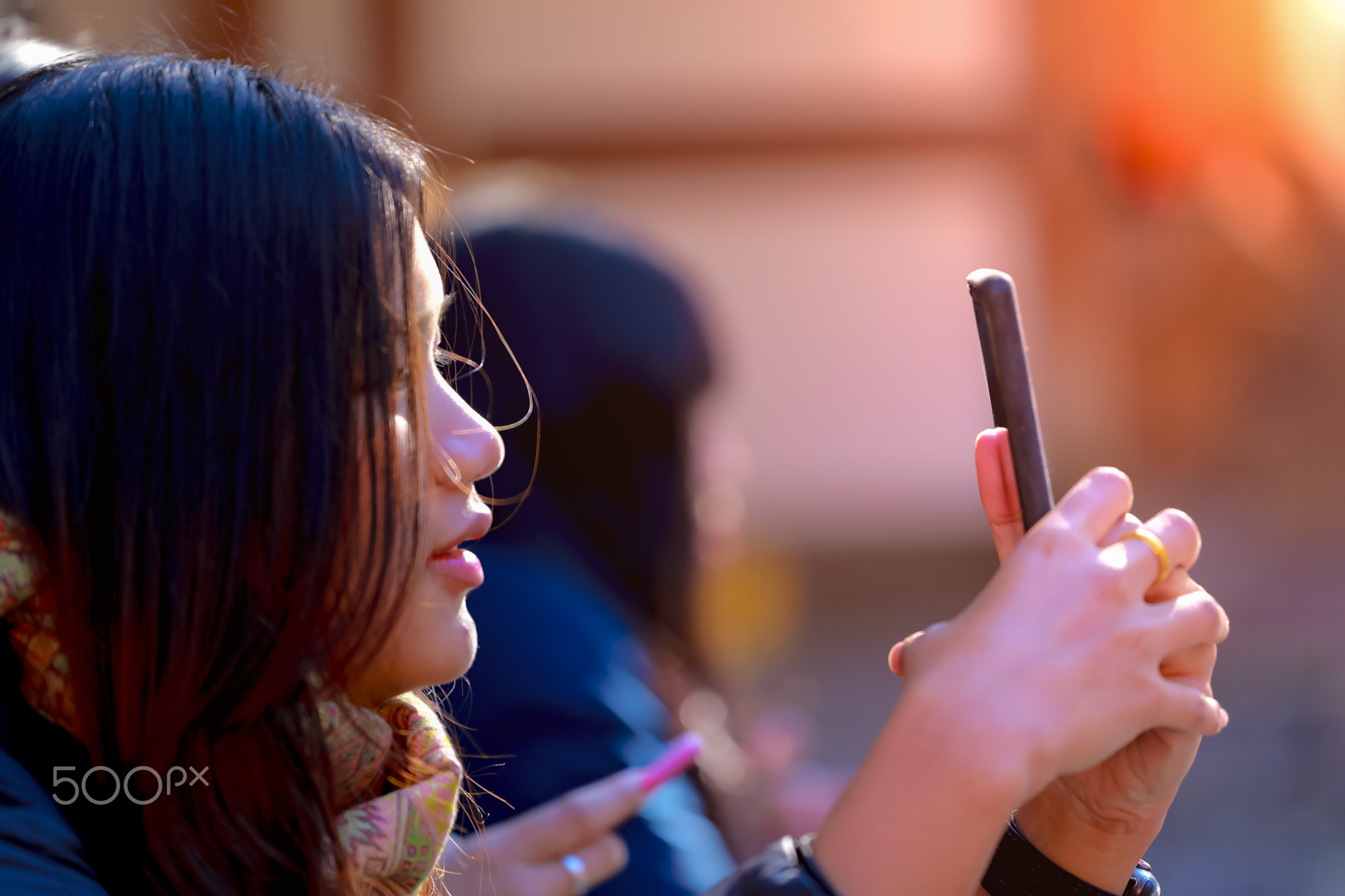 teenage girl using smartphone and smile