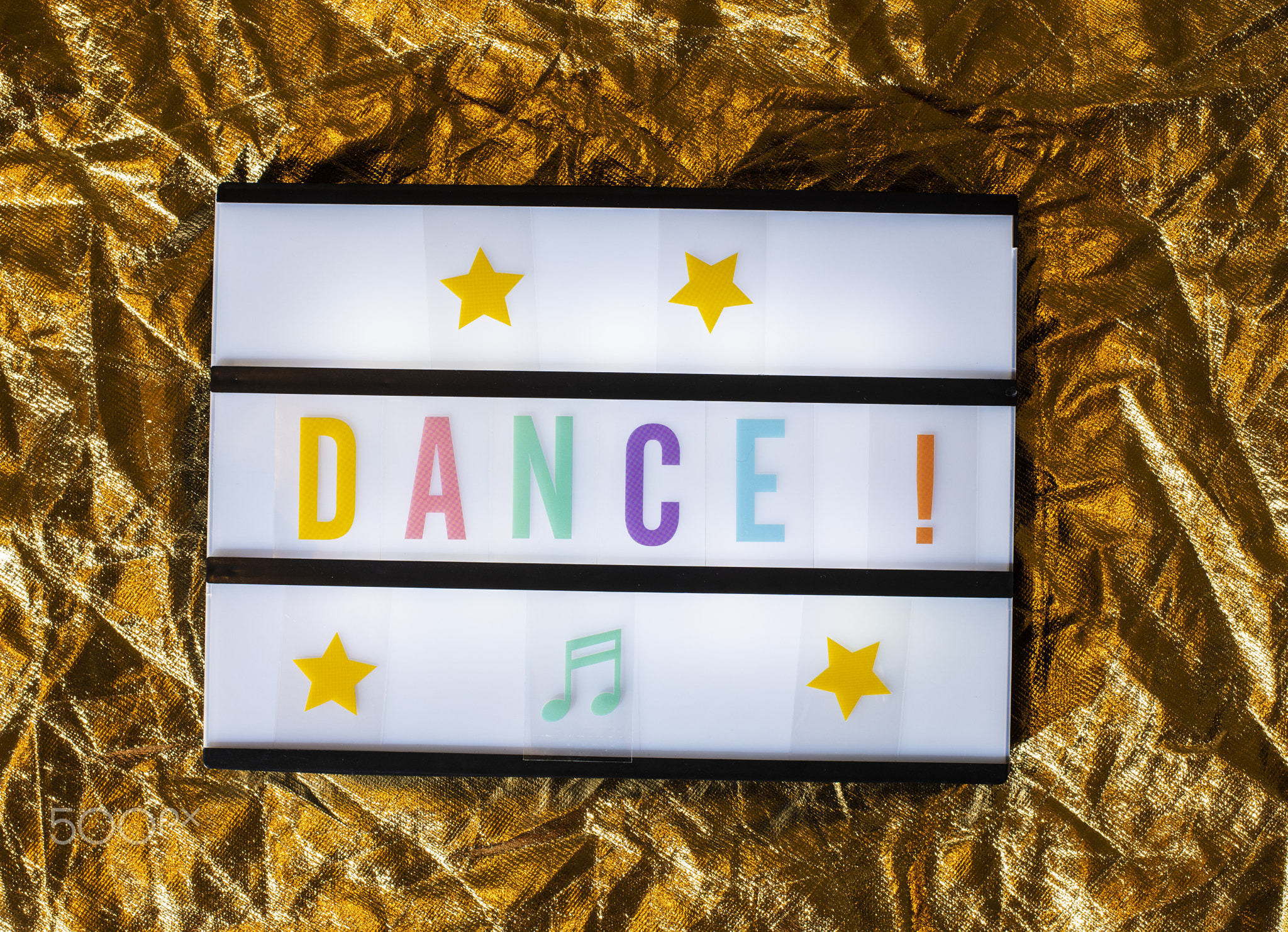 Text Dance on white illuminated board. Conceptual message for en