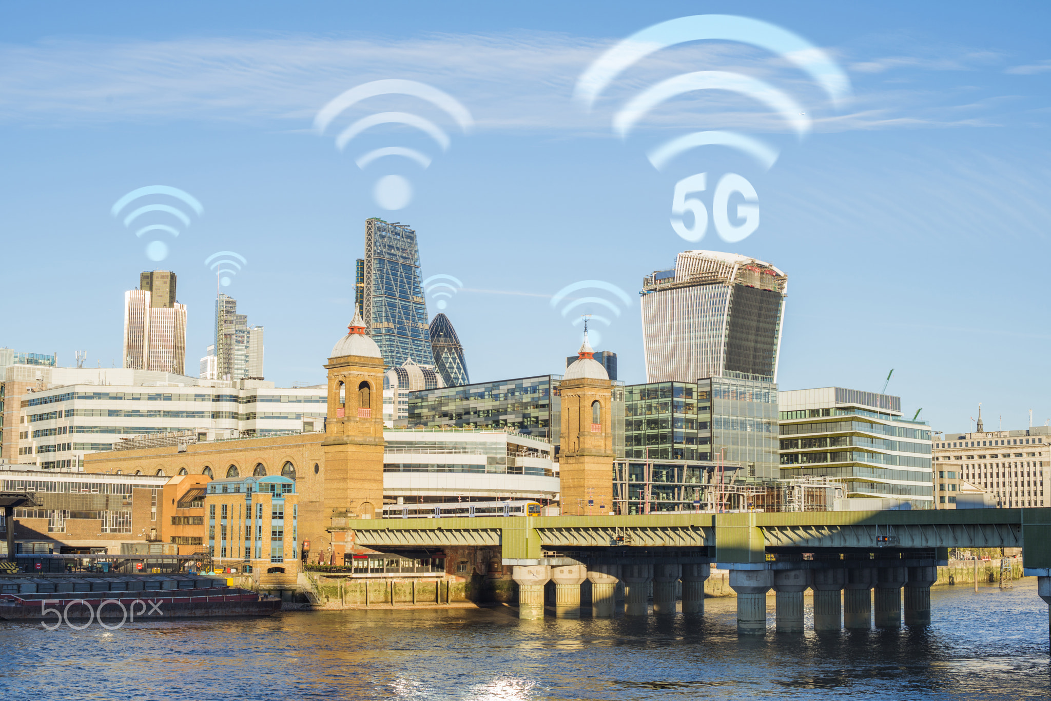 5G concept in the city. Many wireless symbols on the top of the