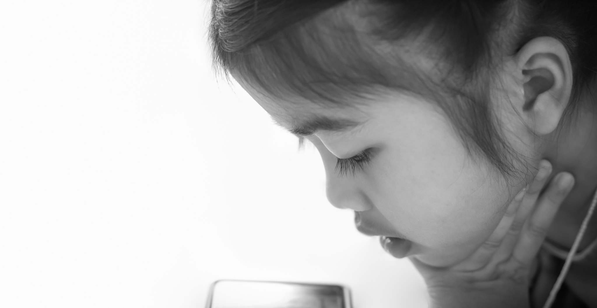 asia children addicted tablet. asian child watching tablet / kid