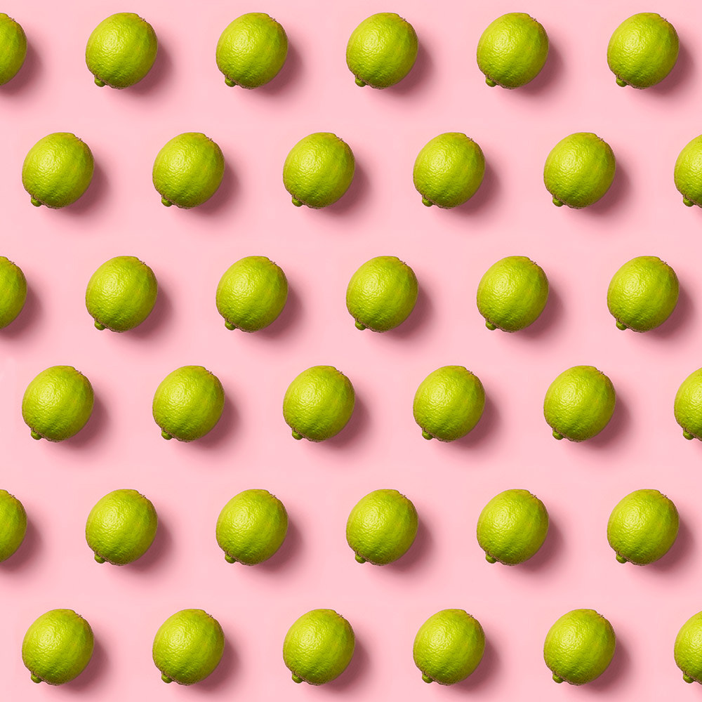Limes pattern on pink background. Creative food concept. Flat la by Natalia Klenova on 500px.com