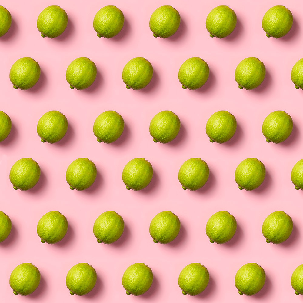 Limes pattern on pink background. Creative food concept. Flat la by Natalia Klenova on 500px.com