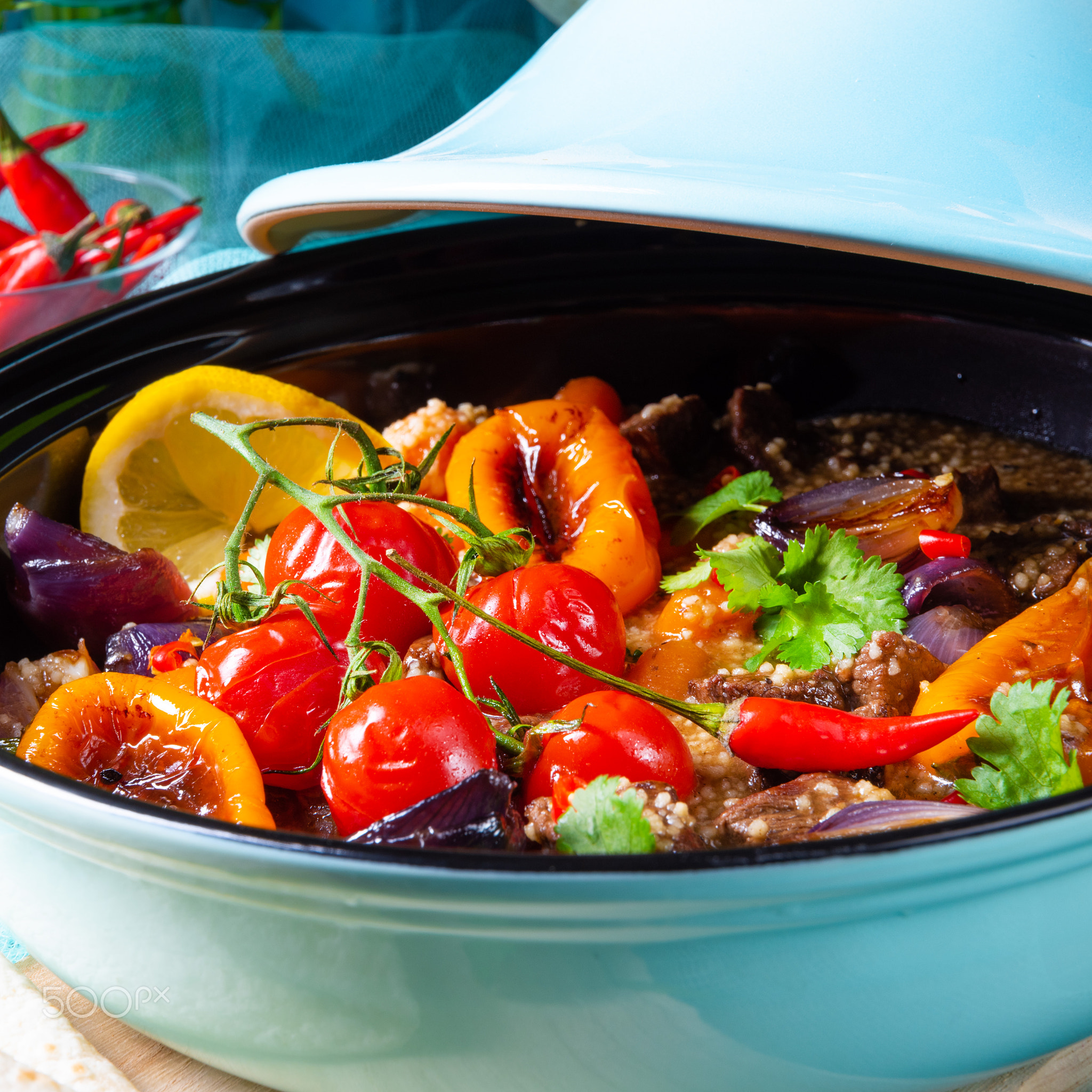 Tasty spicy beef with various vegetables cooked in tagine