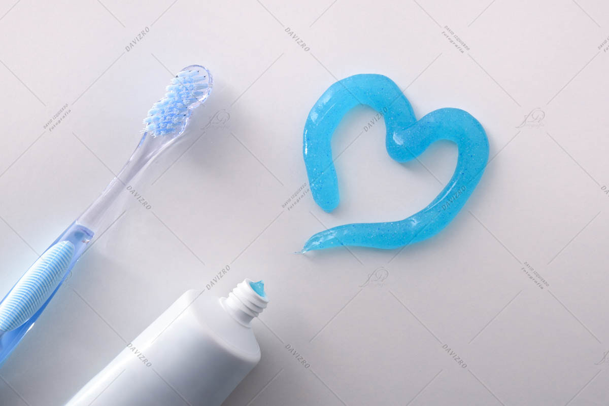 Dental health concept with toothbrush tube and toothpaste heart