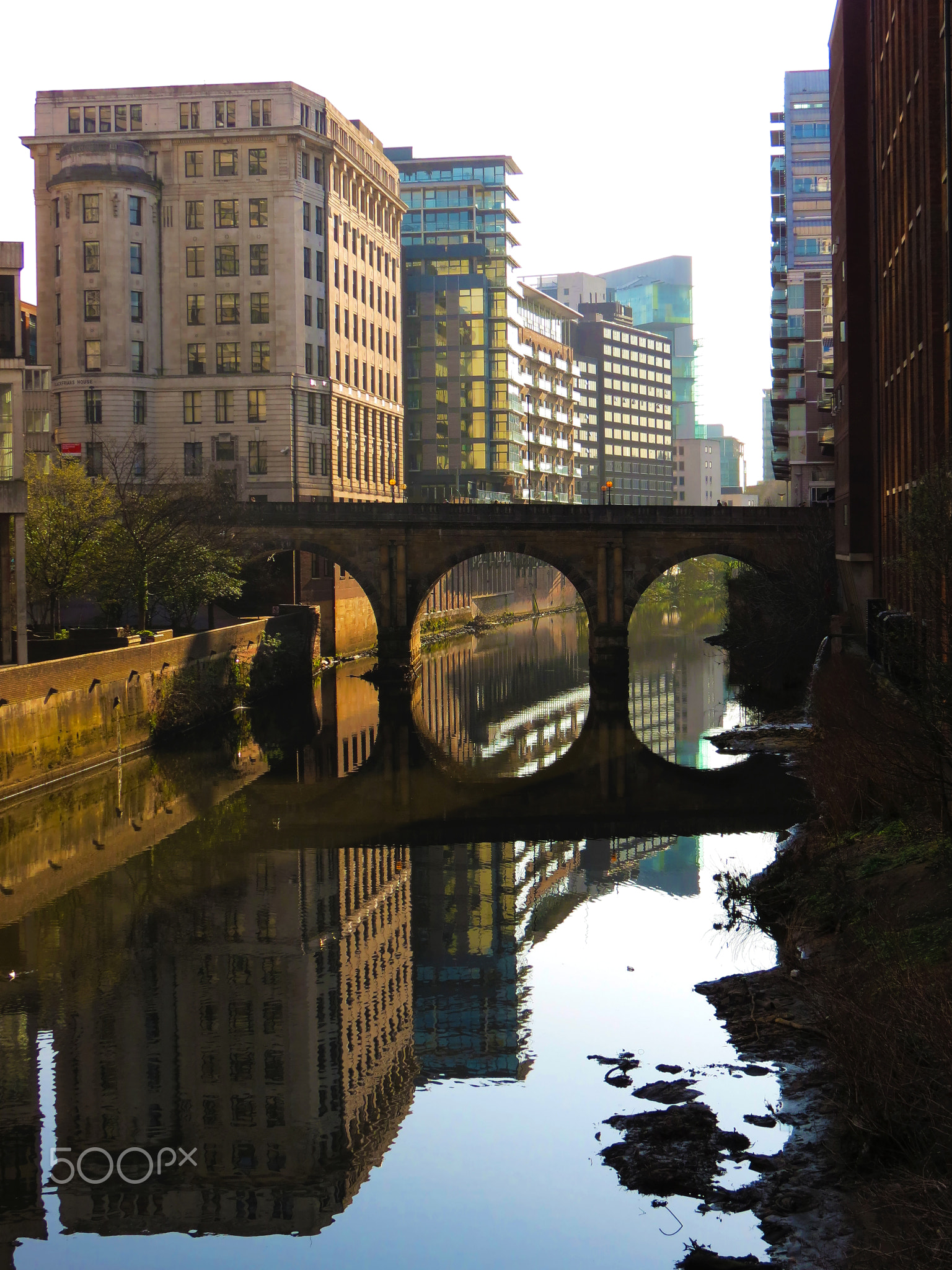 Manchester, UK - 27/03/2012: The peaceful view of the River Irwell canal under the sunlight