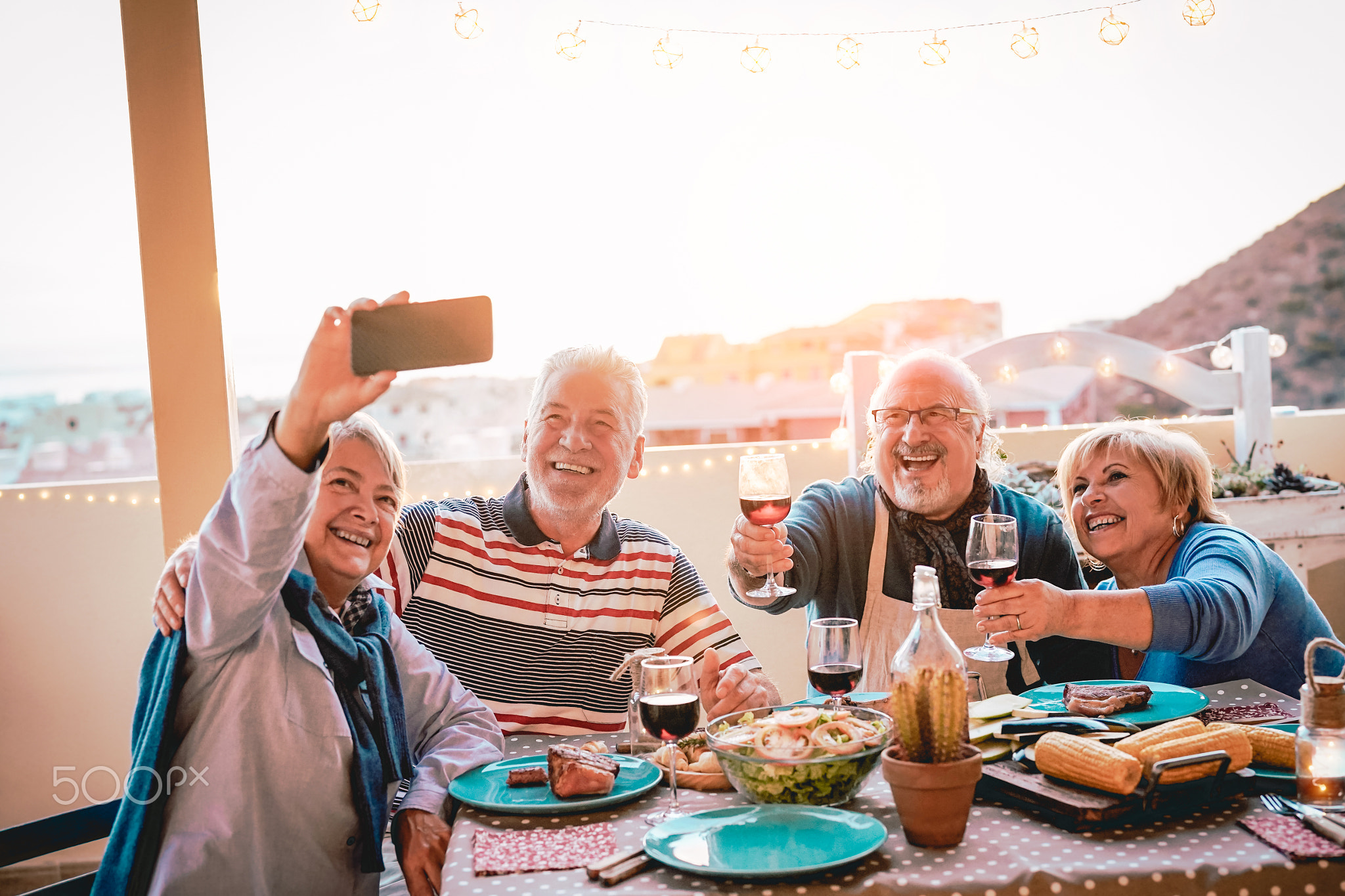 Happy seniors friends taking selfie with mobile smartphone