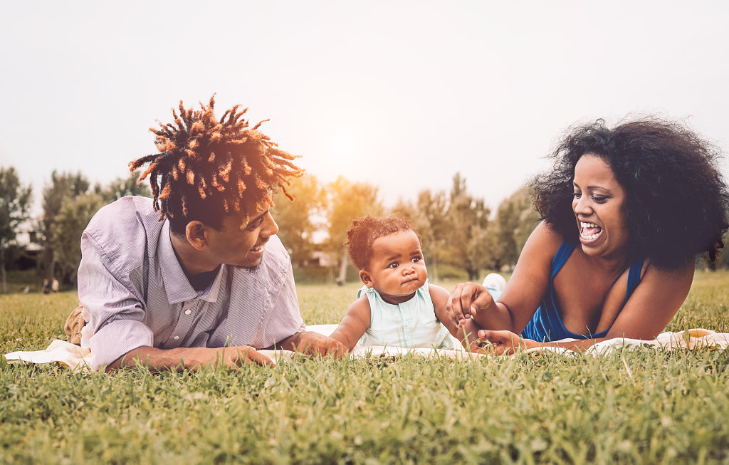 Happy African family enjoying together a weekend sunny day by Alessandro Biascioli on 500px.com