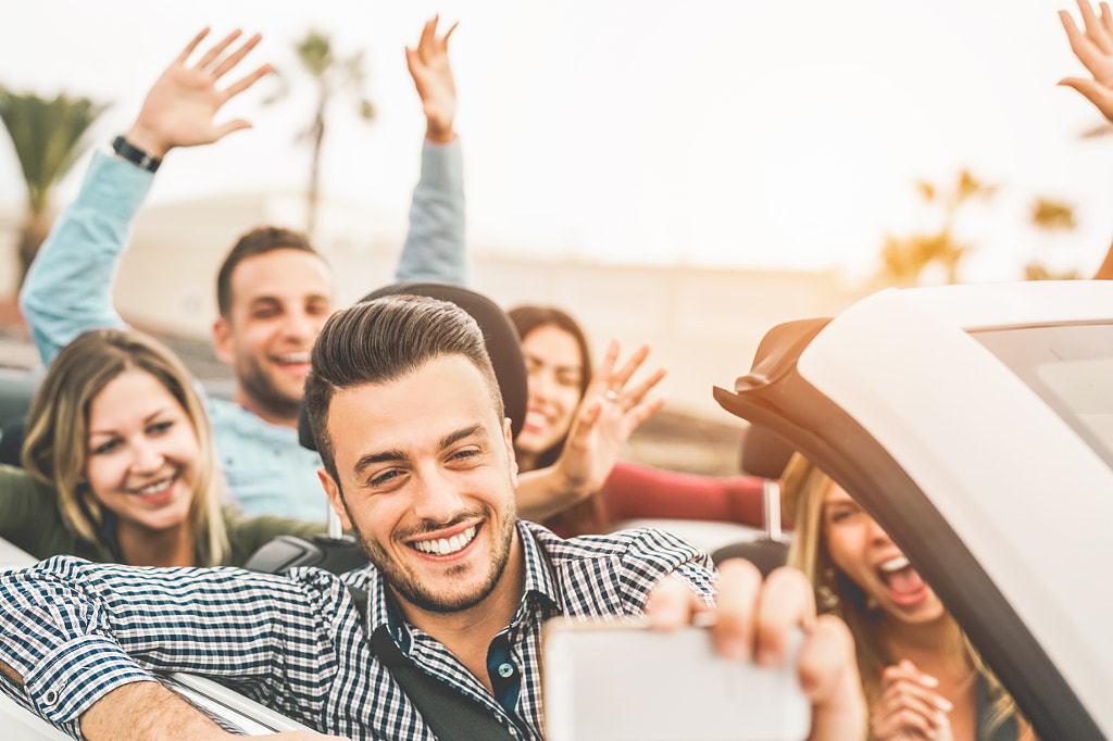 Happy friends taking photo selfie with mobile smart phone camera by Alessandro Biascioli on 500px.com