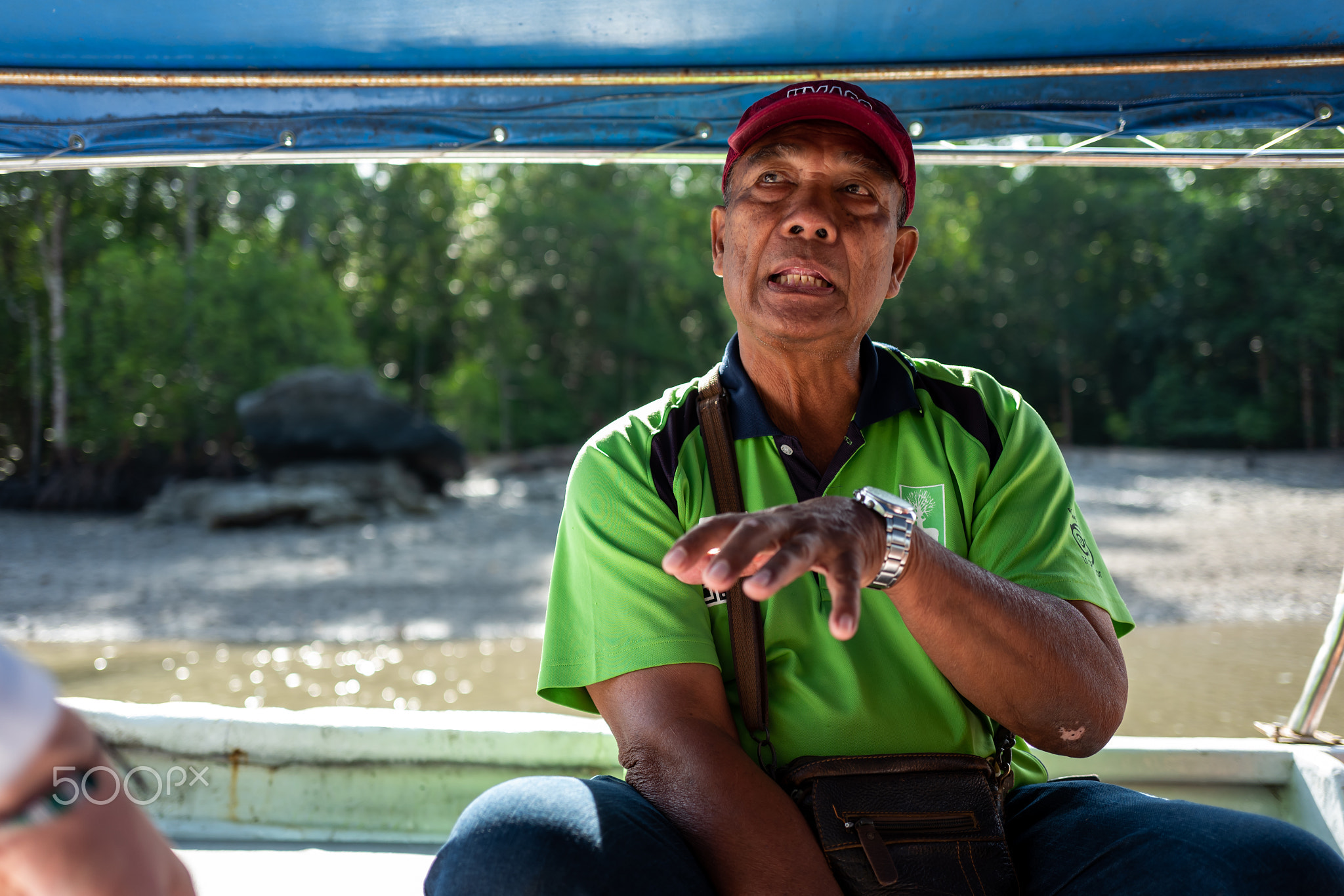 Langkawi, Malaysia - February 23, 2019: Local Ranger speaks at Mangroves tour in Kilim Karst...