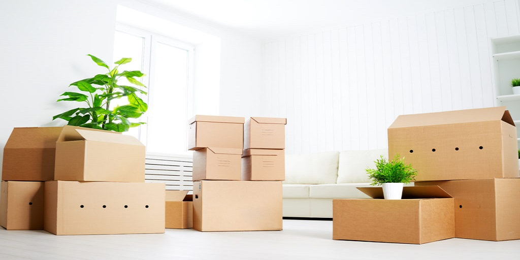 move. lots of cardboard boxes in empty new apartment
