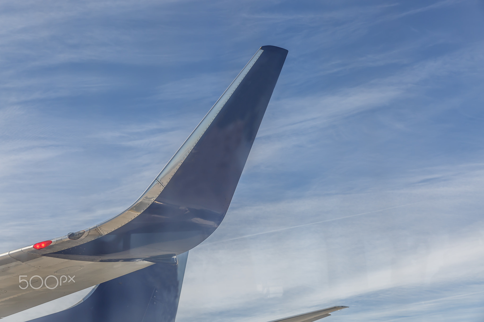 Tails of two commercial flight aircraft
