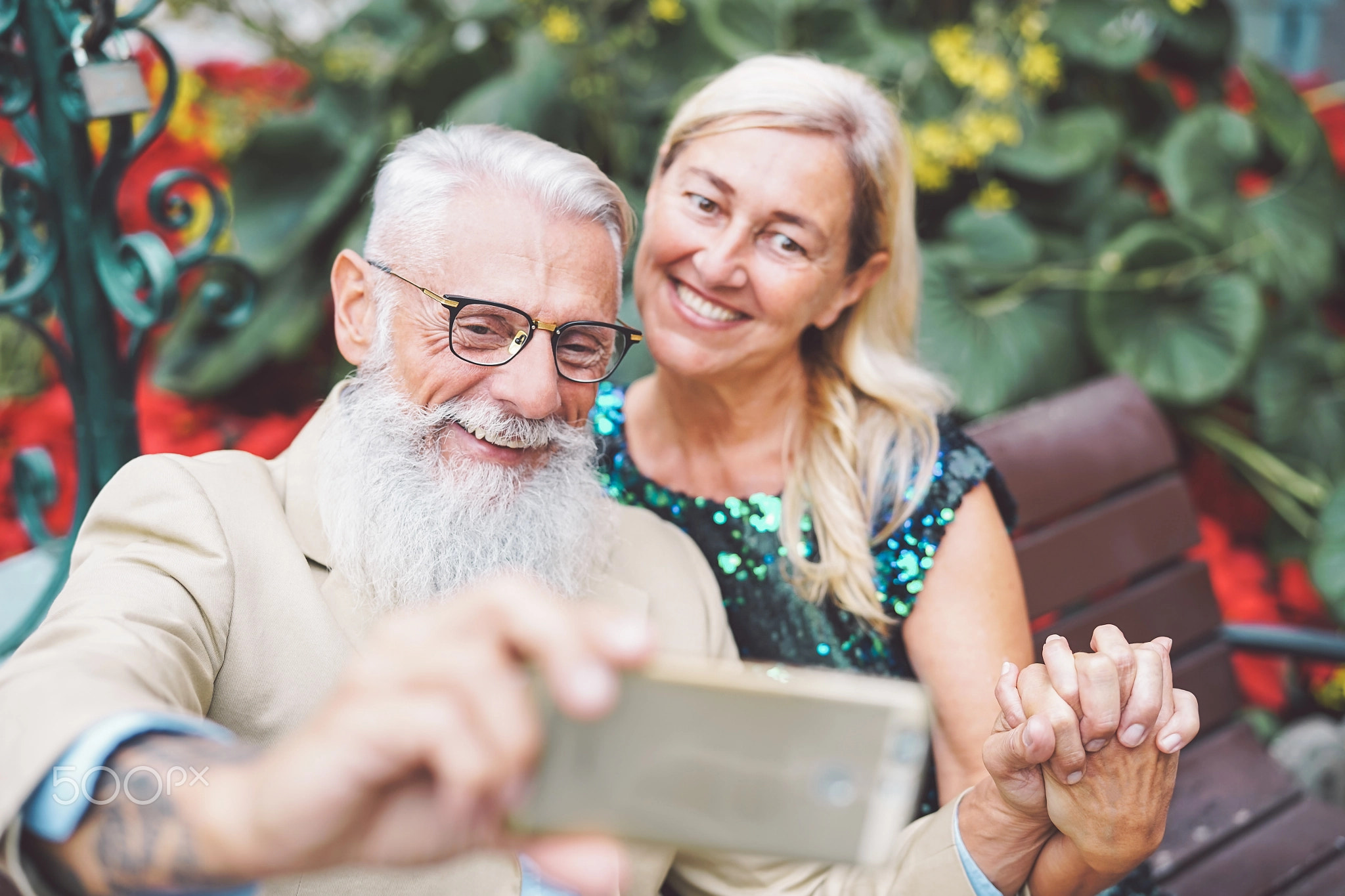 Happy senior couple taking a selfie with mobile smart phone