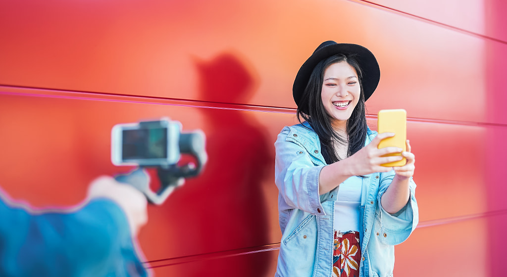 Asian fashion woman vlogging and using mobile smart phone by Alessandro Biascioli on 500px.com