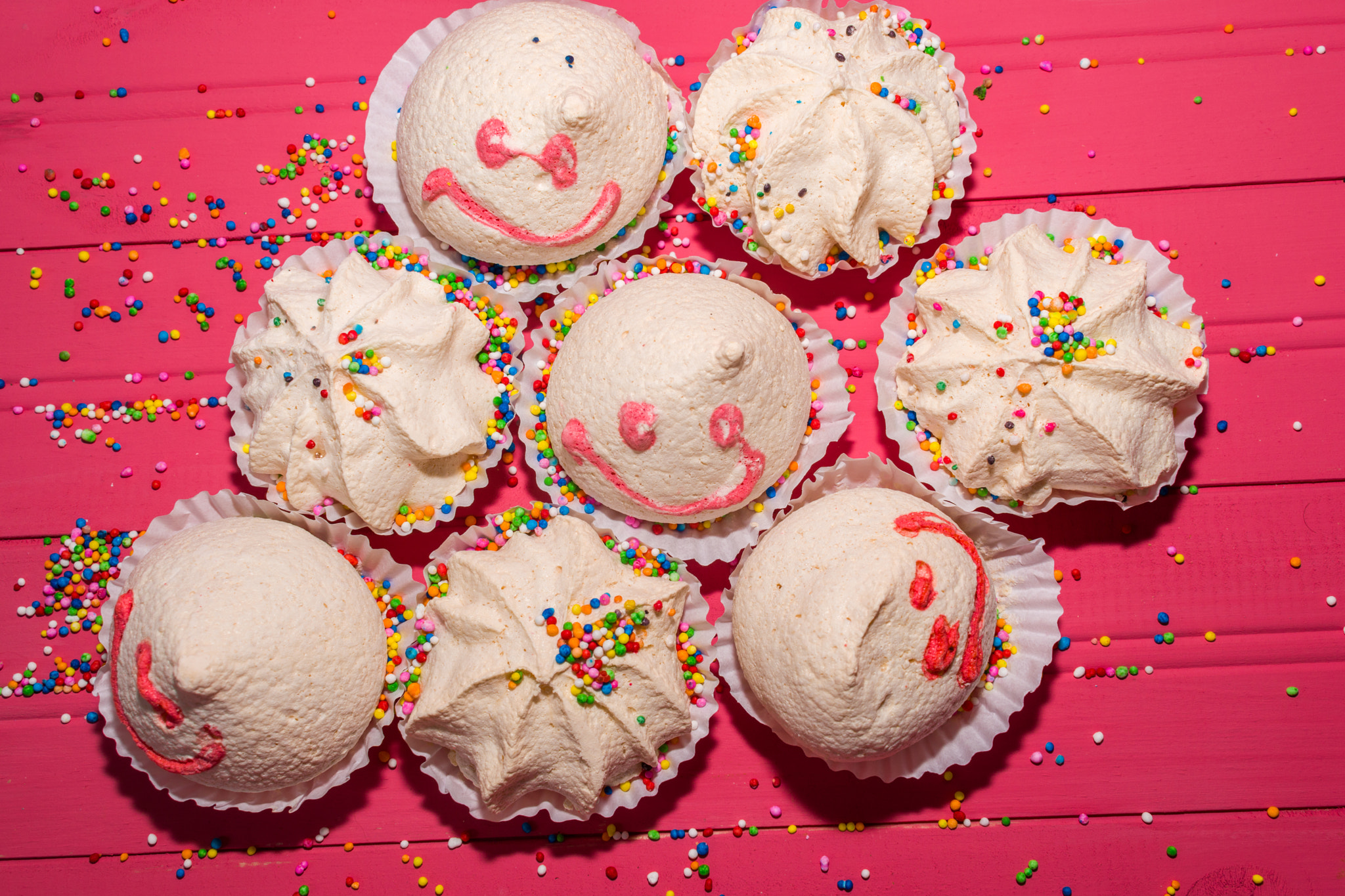 meringues with colorful sparks and happy wands