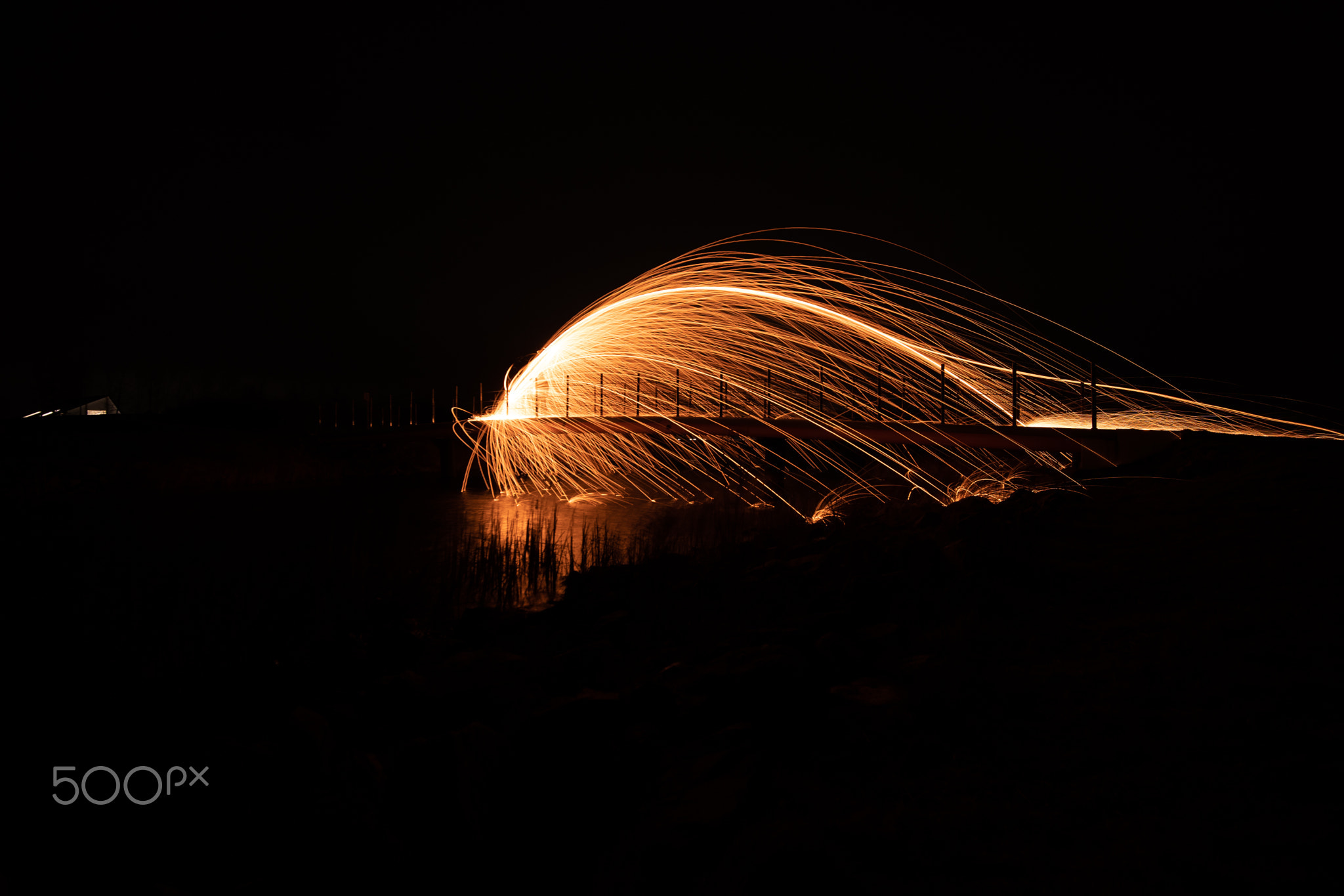 Lightpainting with burning steel wool in the night