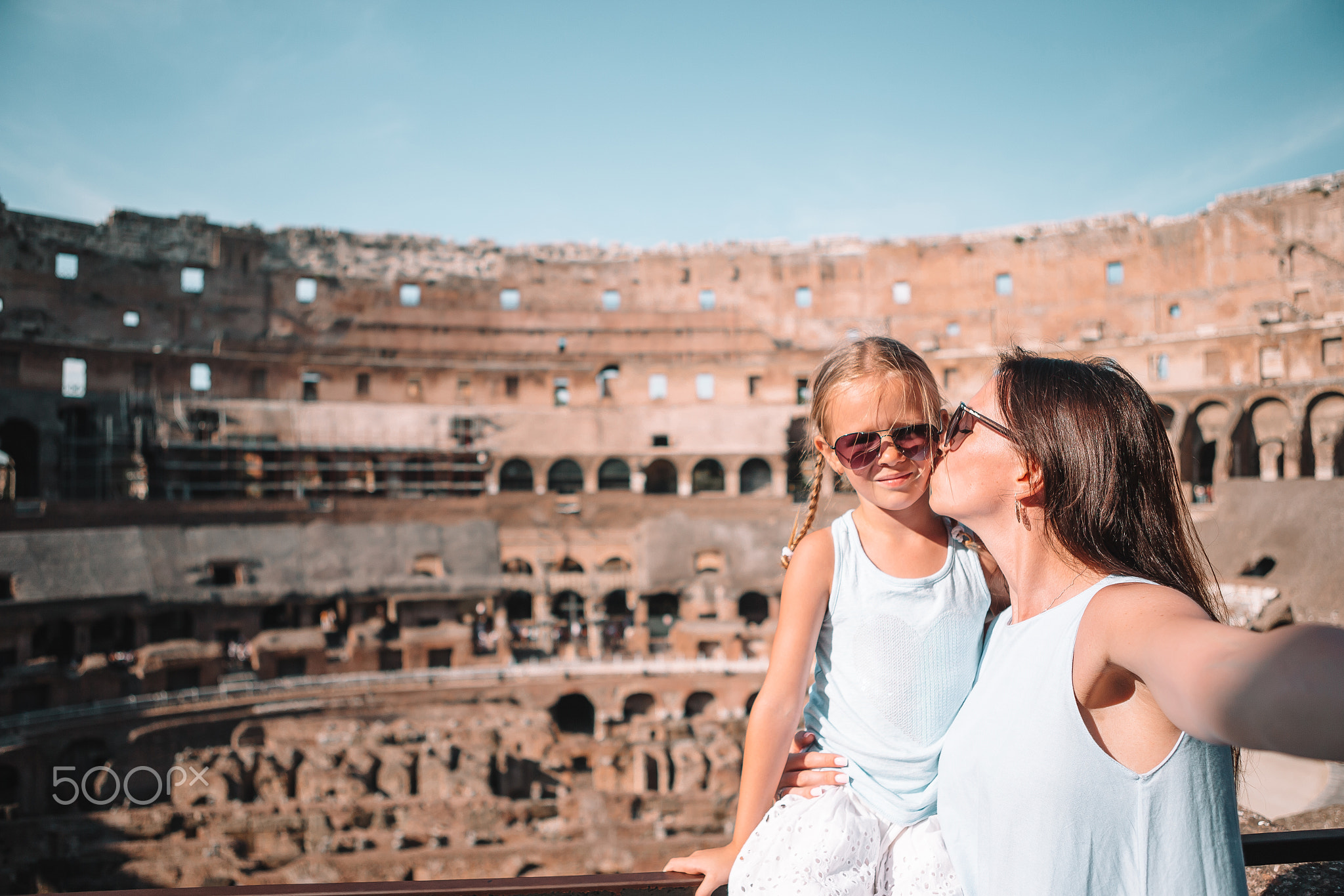 Mother and little happy girl at famous place in Europe