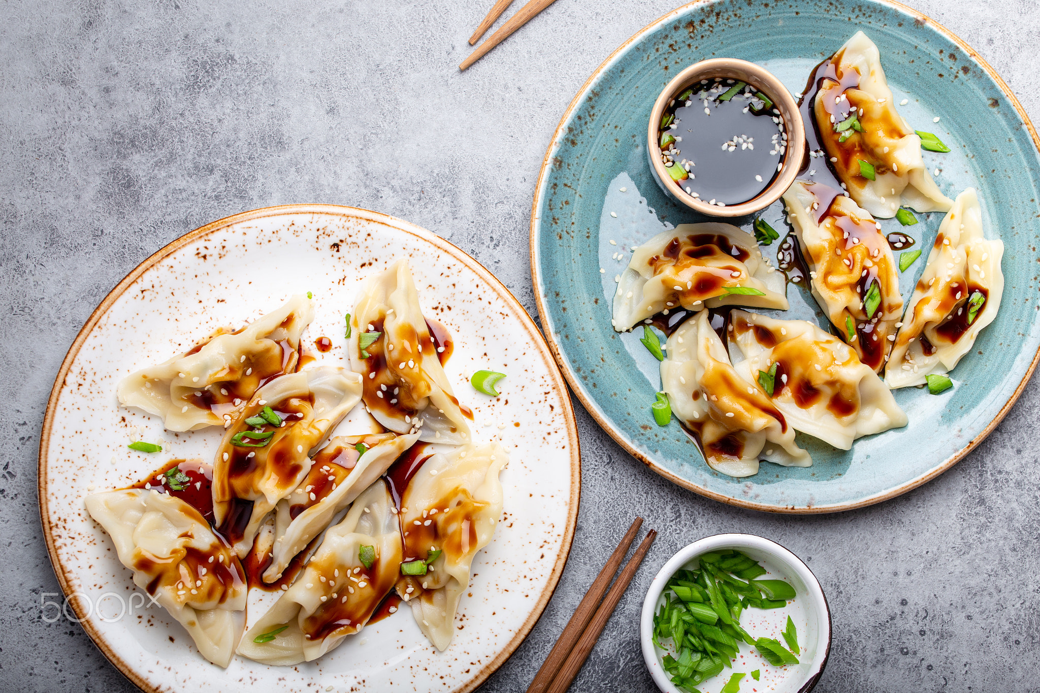 Two plates with asian dumplings
