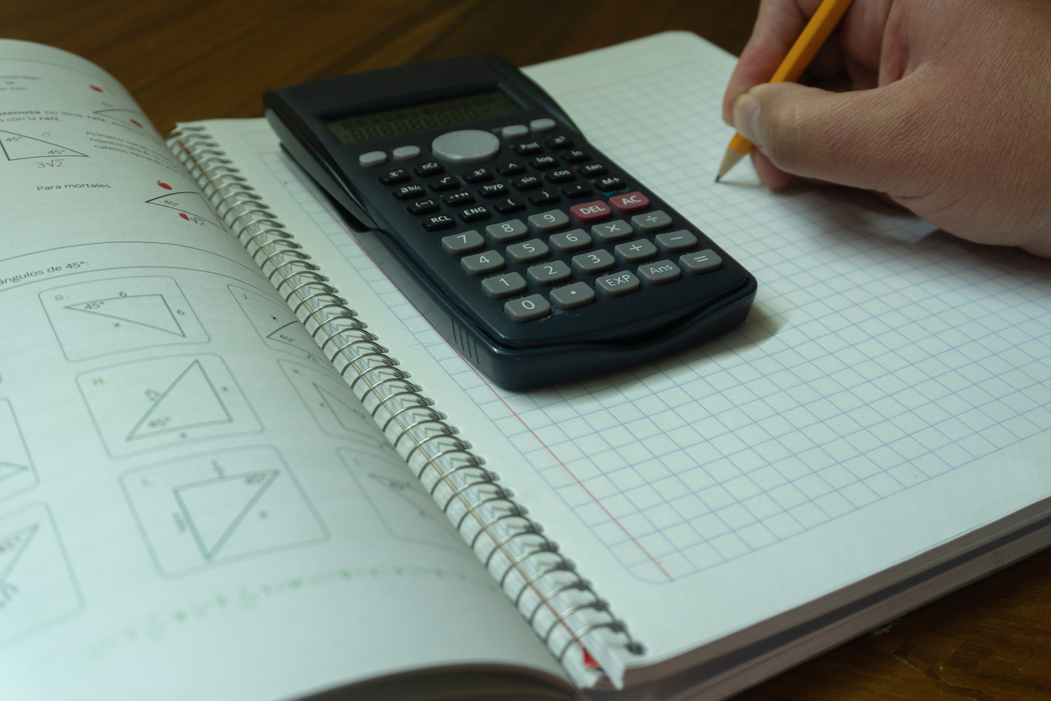 Notebook, calculator and pens.