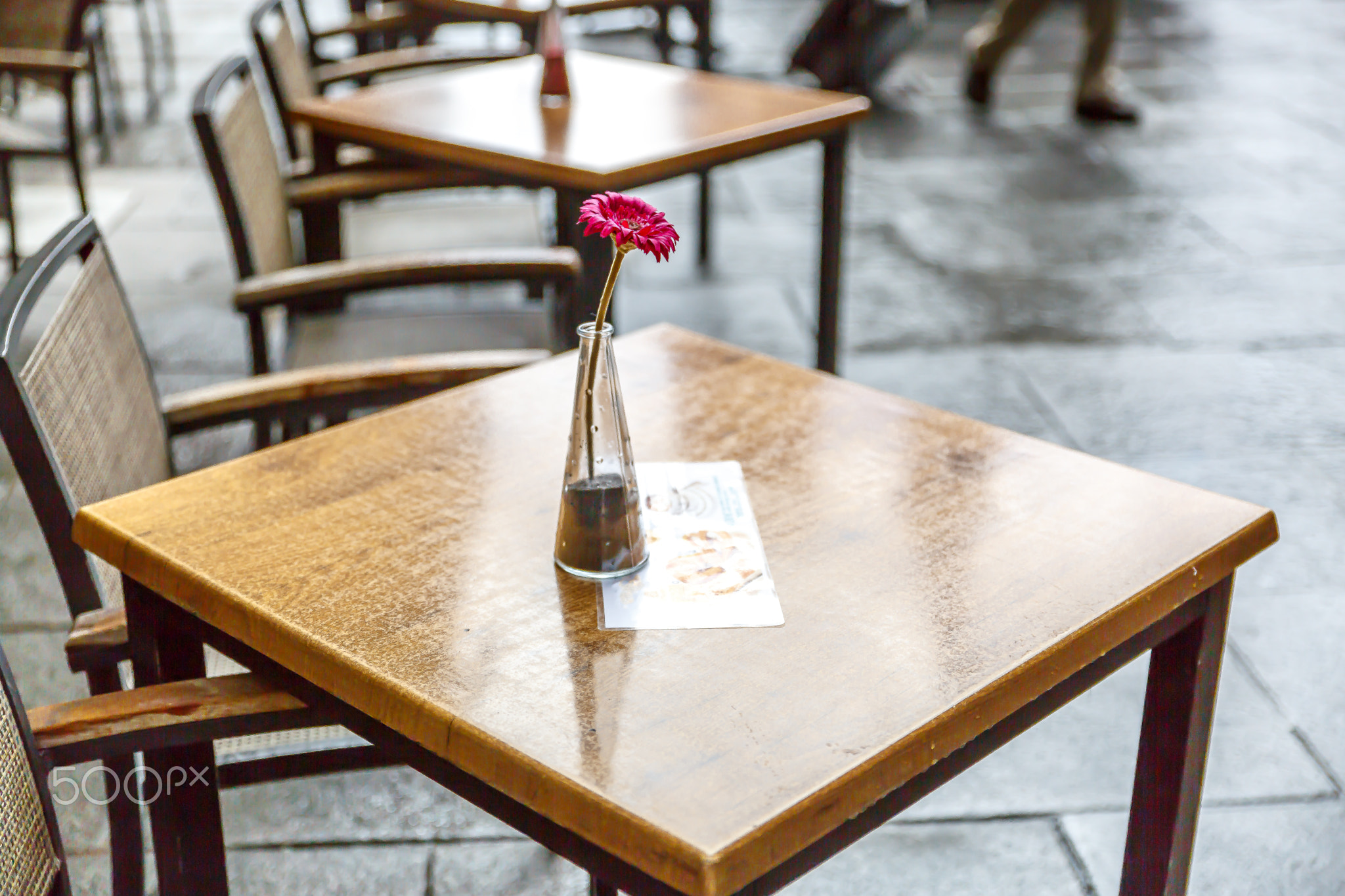 Group of bar tables in a street of Madrid with the detail of a s