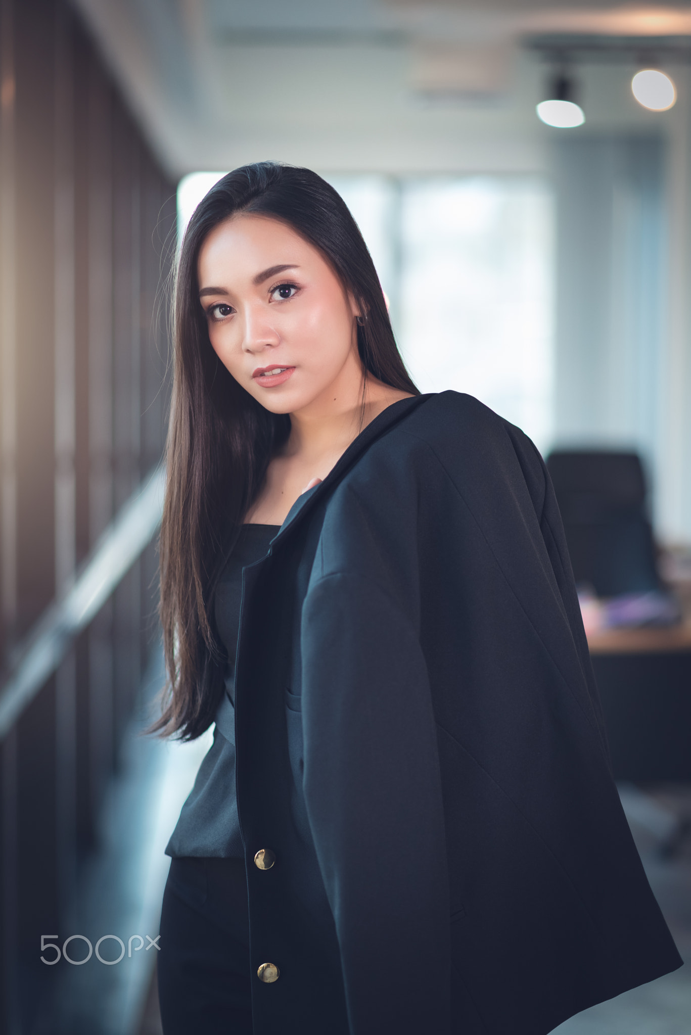 Modern Smart Asian Businesswoman in Black Business Casual Suit in Office