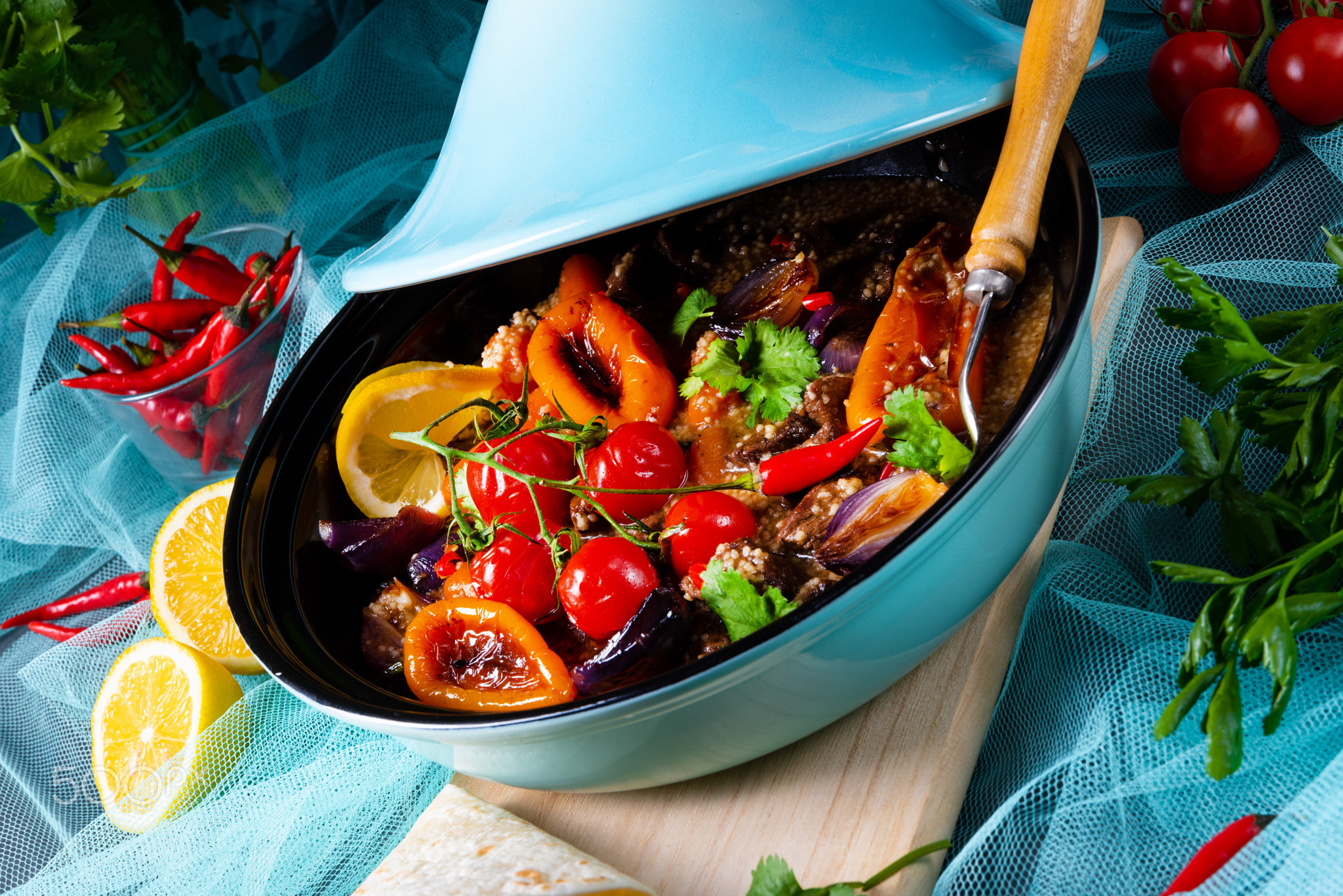 Tasty spicy beef with various vegetables cooked in tagine