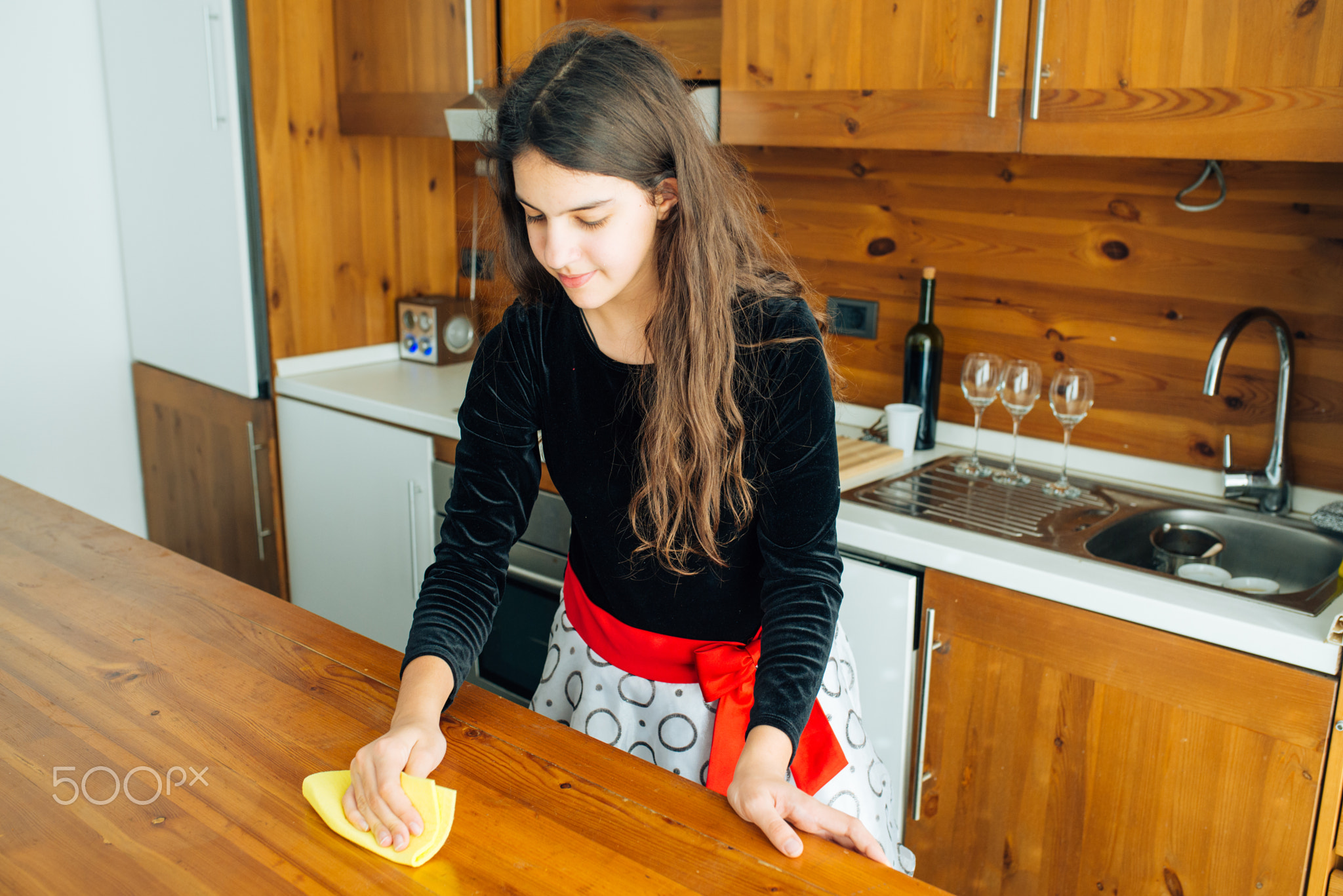 Daughter Polishing The Kitchen