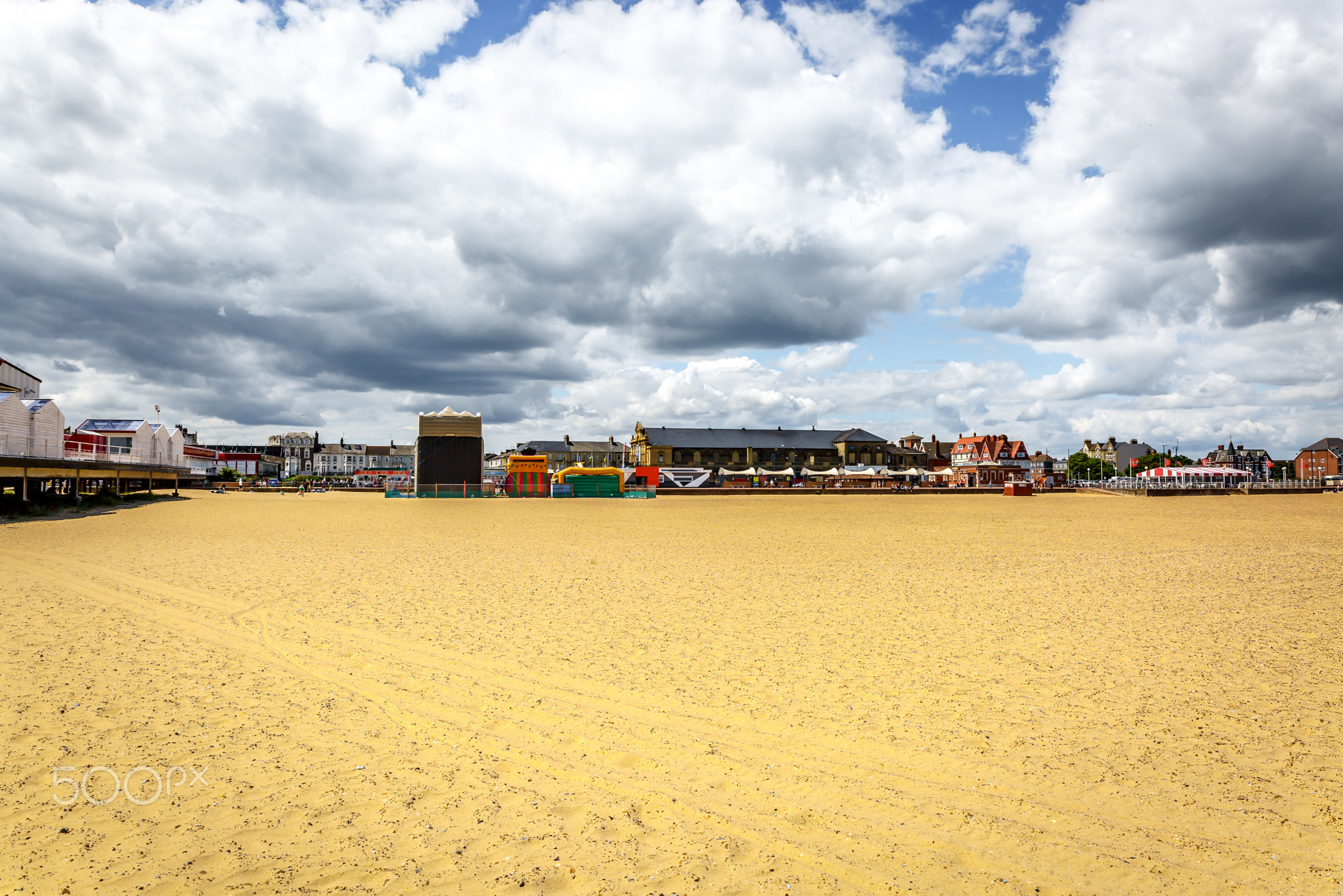 Great Yarmouth beach with city in background, on a sunny day