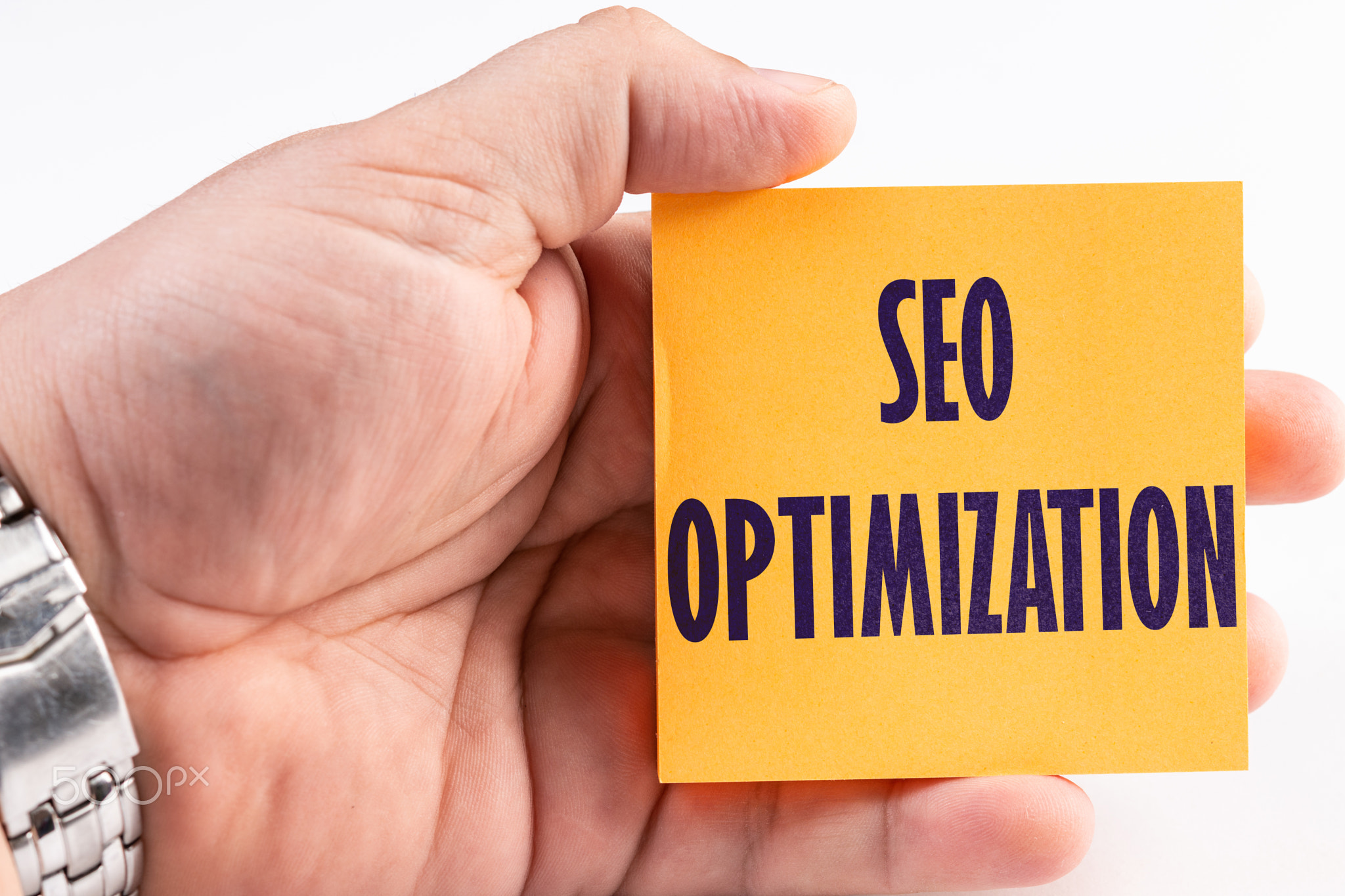 SEO Optimization Text Concept On The Sticky Notes Paper In The Hand