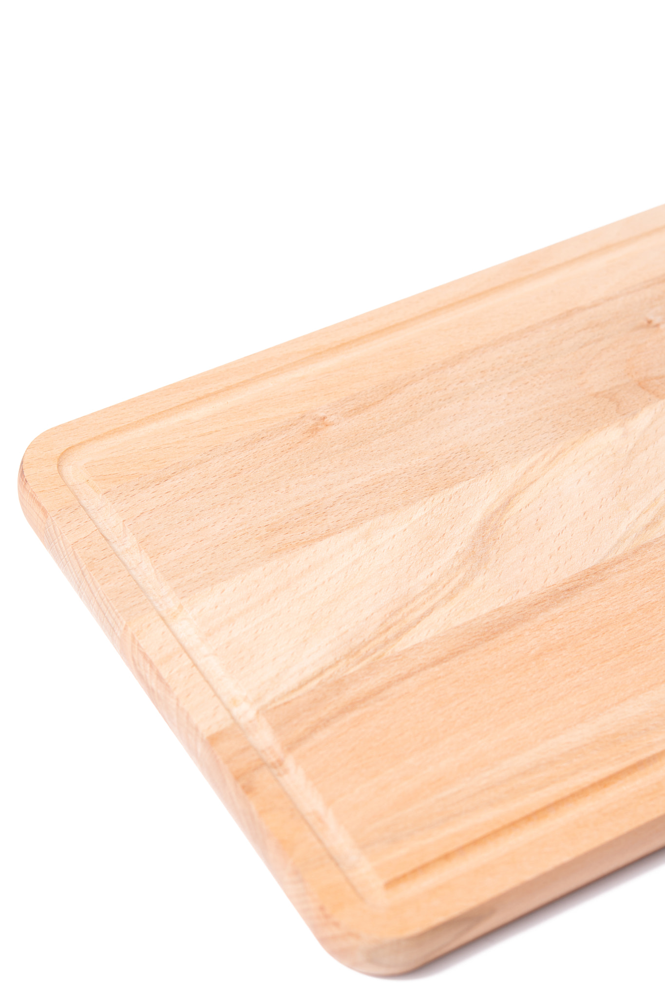 Brand new kitchen rectangle wooden board for cutting food groceries isolated above white background.