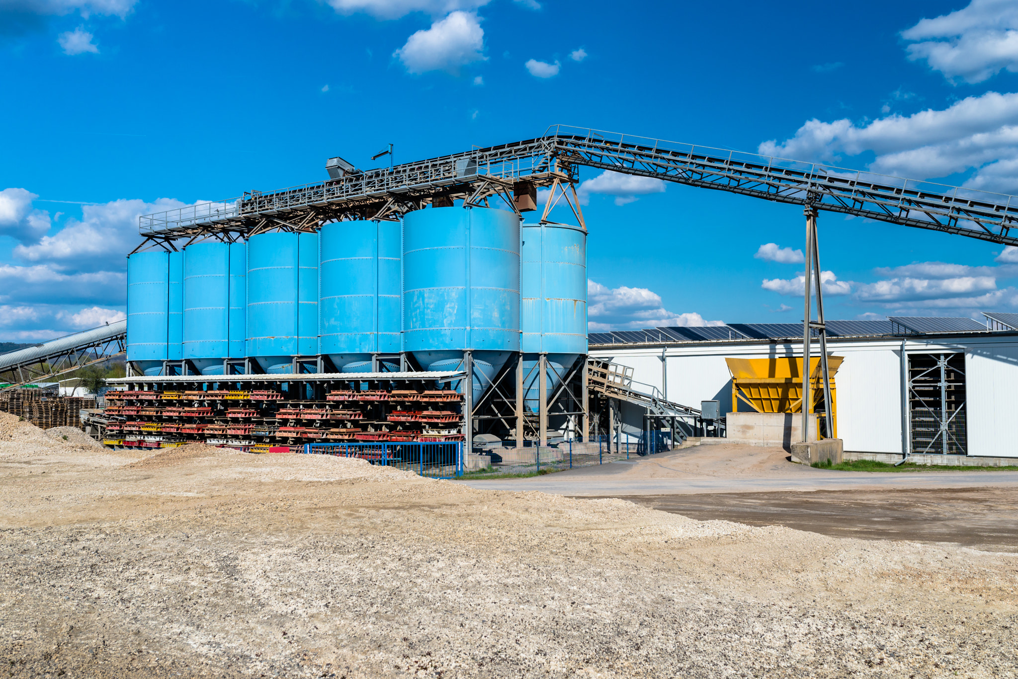 Big blue metallic Industrial silos for the prod