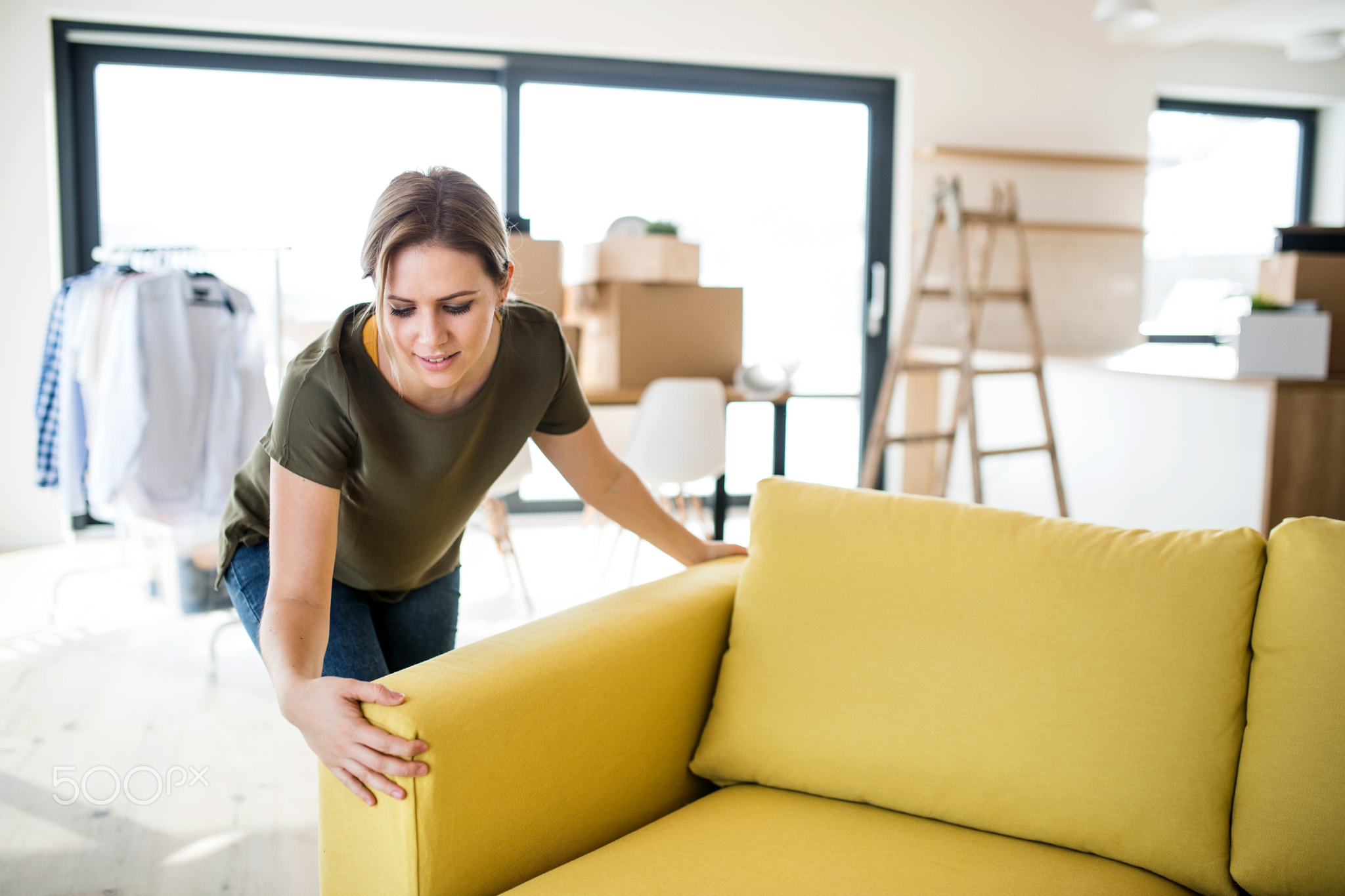 A young woman moving in new home.