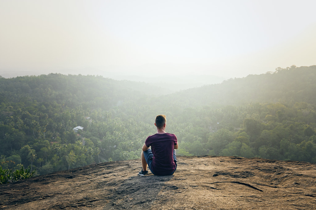 Man resting on top of rock by Jaromír Chalabala on 500px.com