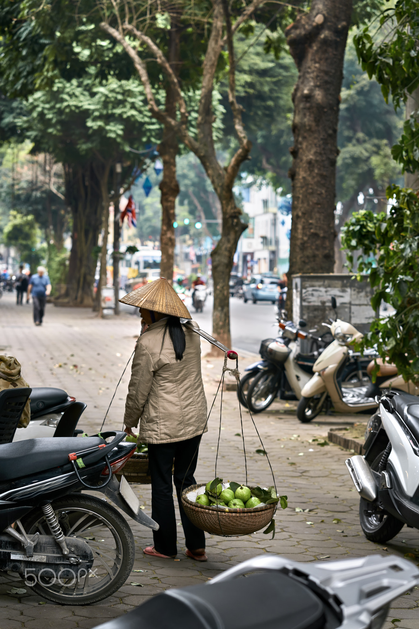 Picturesque asian city street with citizens and traffic