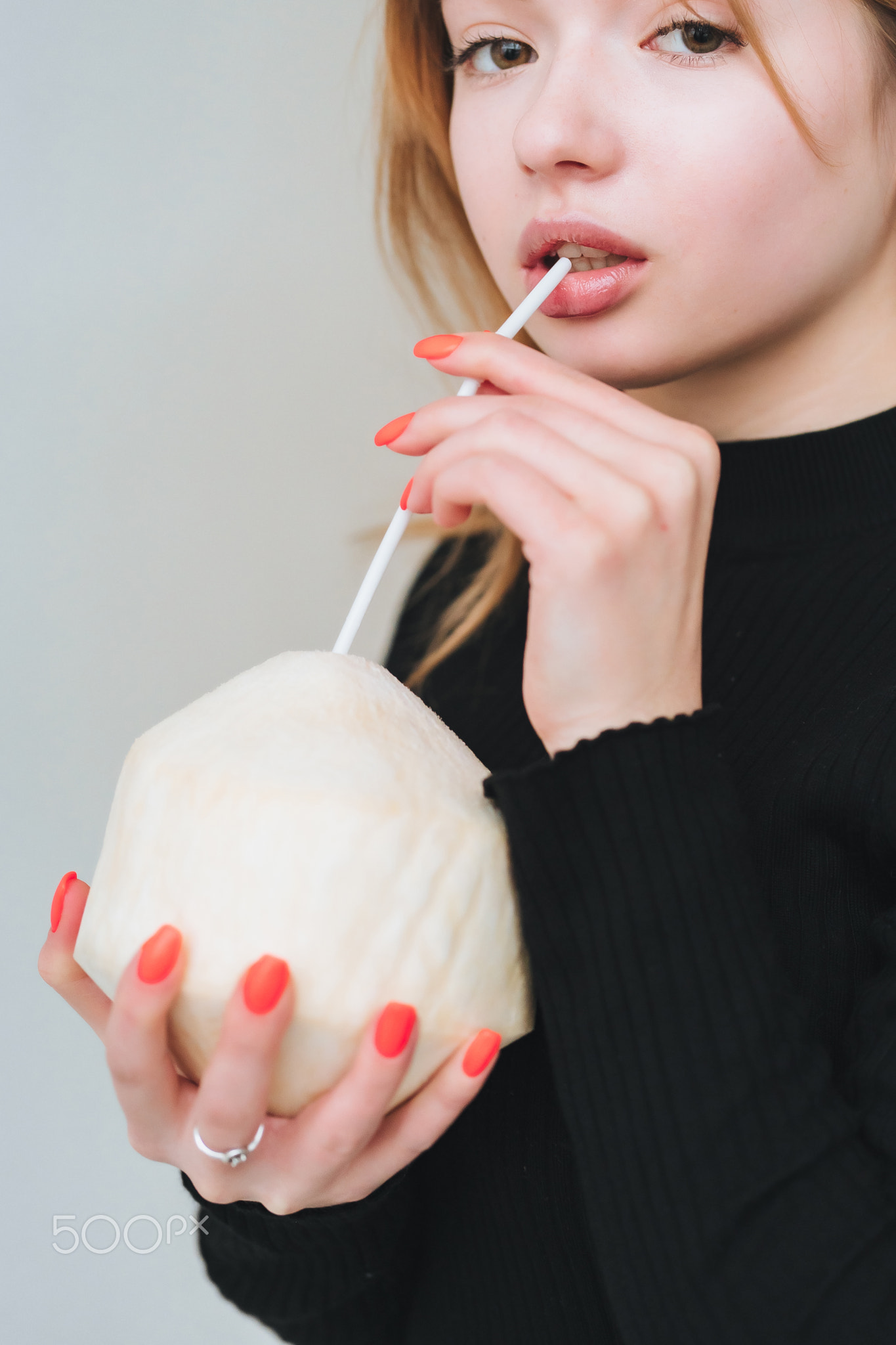 Portrait of a pretty smiling woman posing isolated