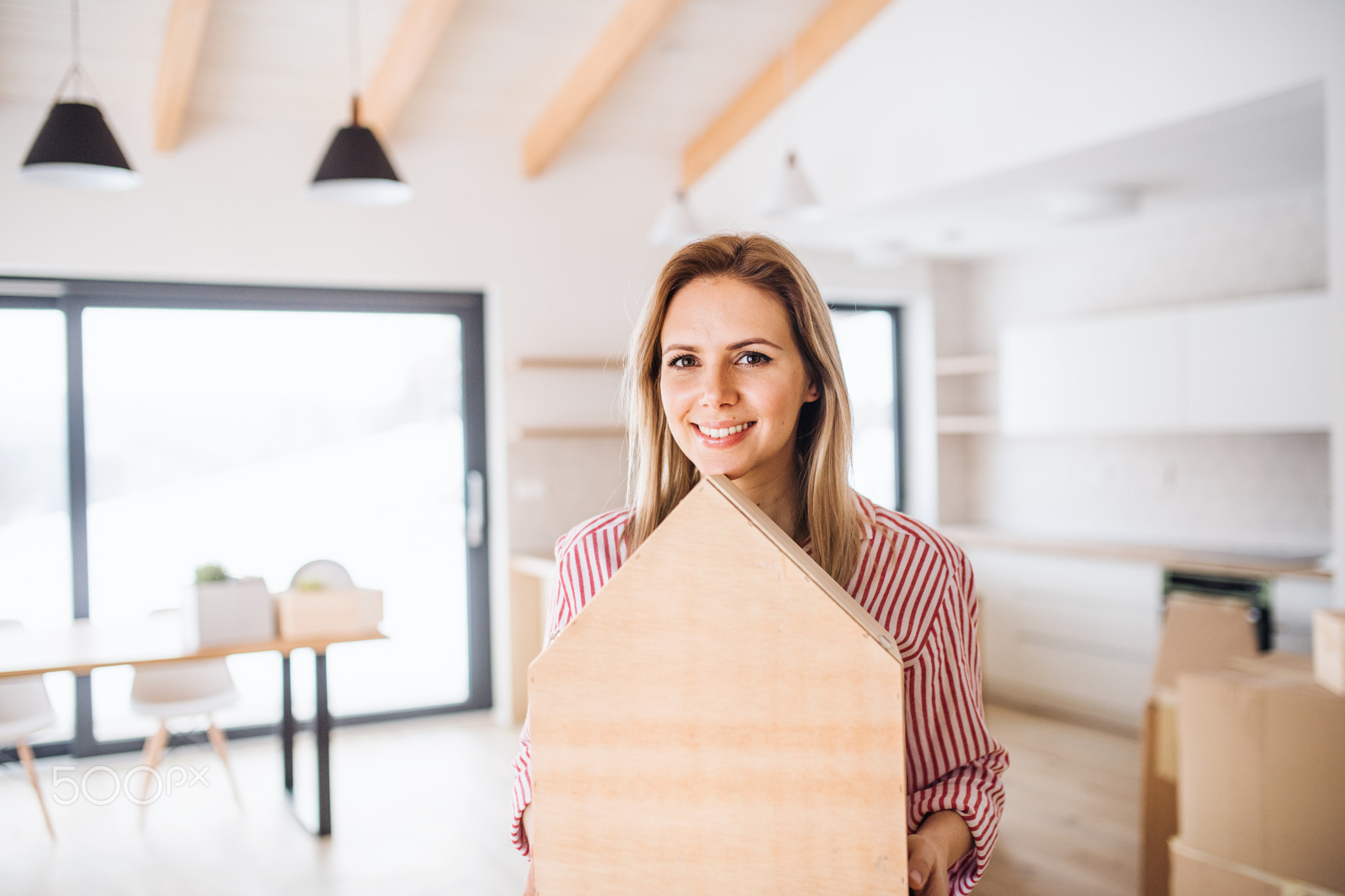 A young woman moving in new home, a concept.