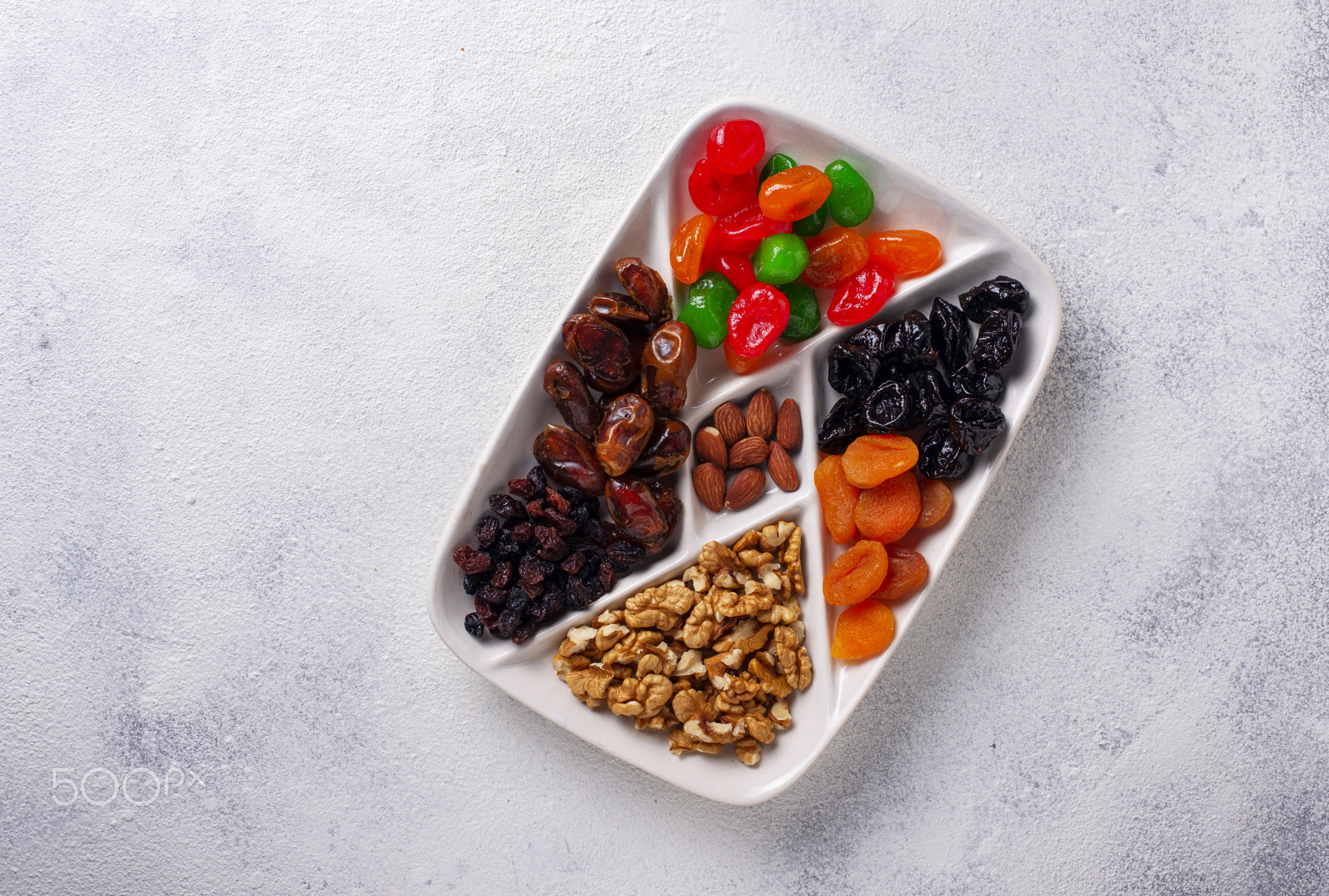 Mix of dried fruits and nuts in plate