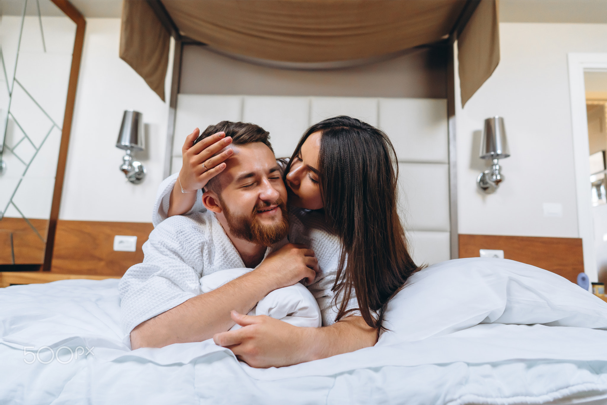 Picture showing happy couple resting in hotel room