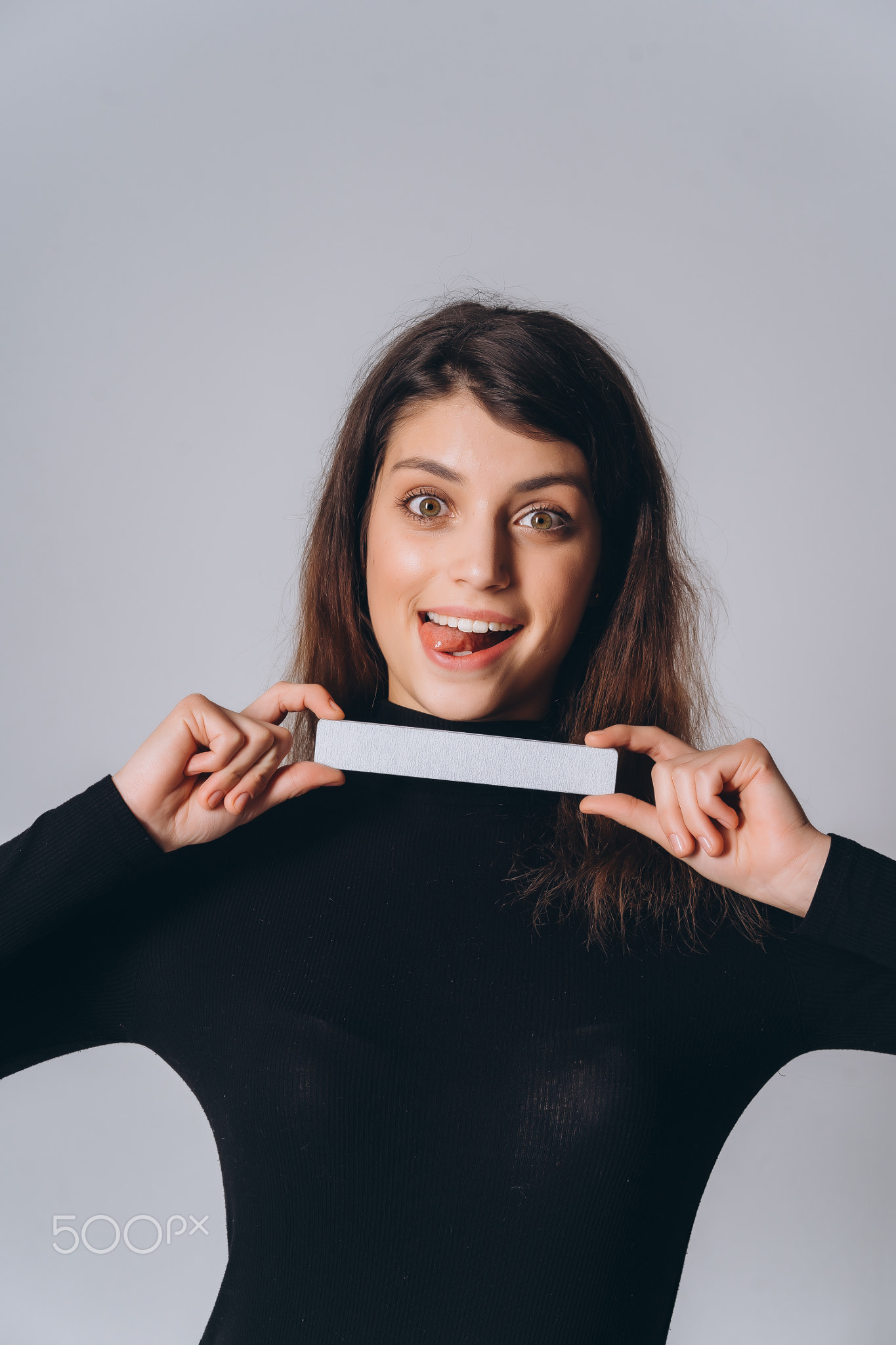 Portrait of a pretty smiling woman posing isolated