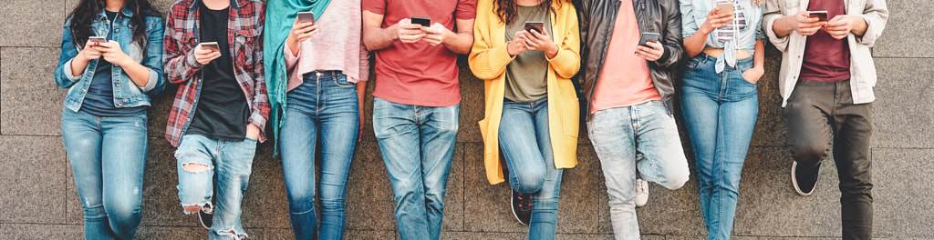 Group of friends using their smart mobile smartphones outdoor by Alessandro Biascioli on 500px.com