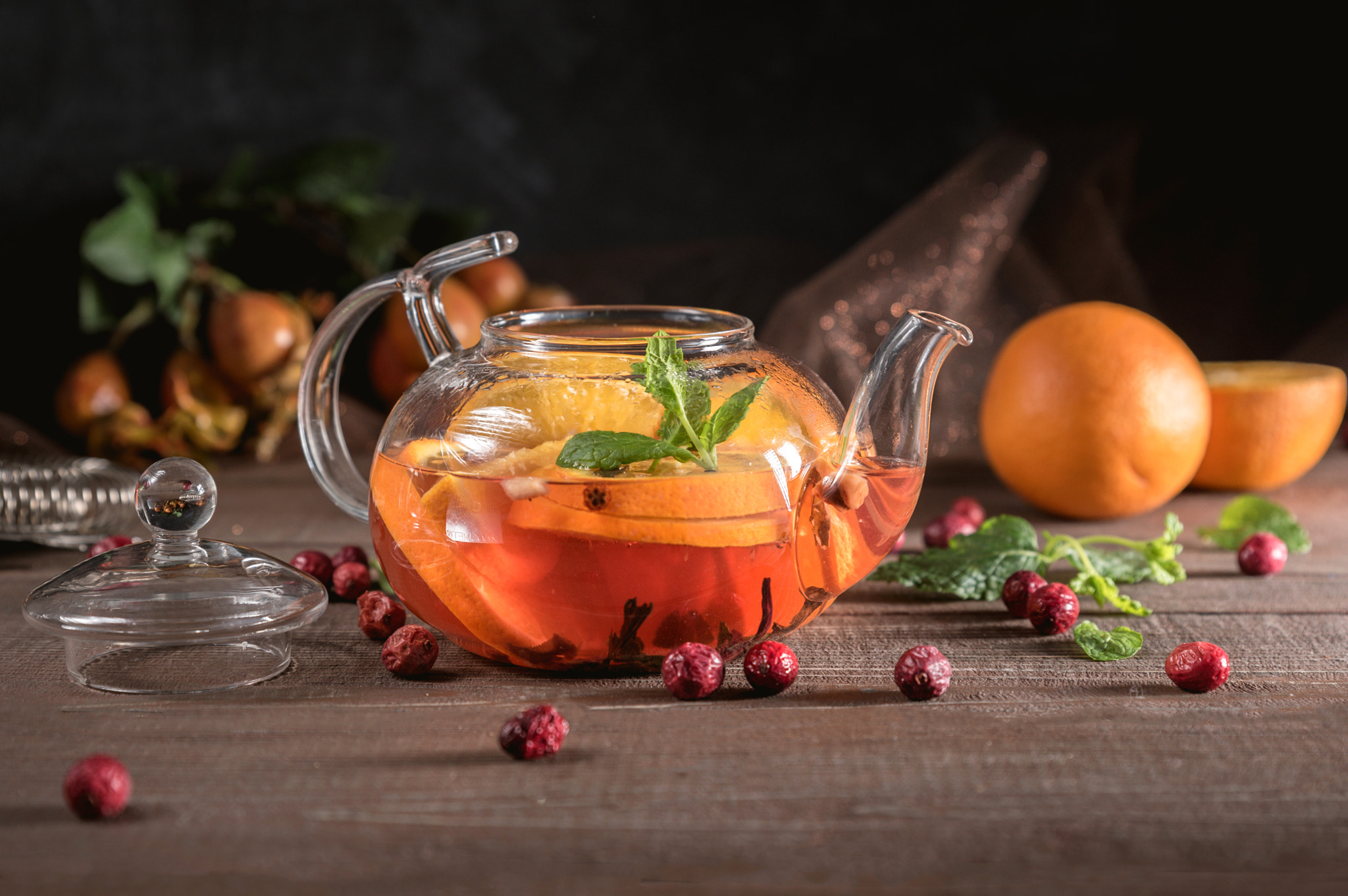 Hot herbal tea with fresh oranges and mint