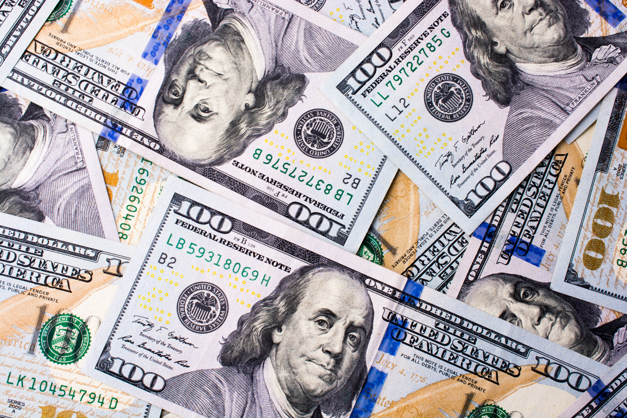 American 100 dollar banknotes placed on white background