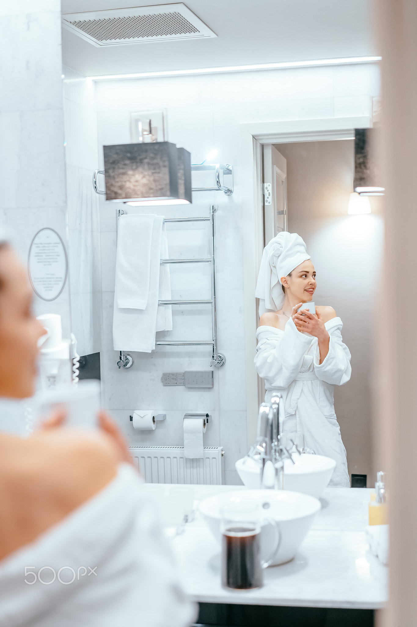 beauty portrait of pretty woman dressing a white bath towel
