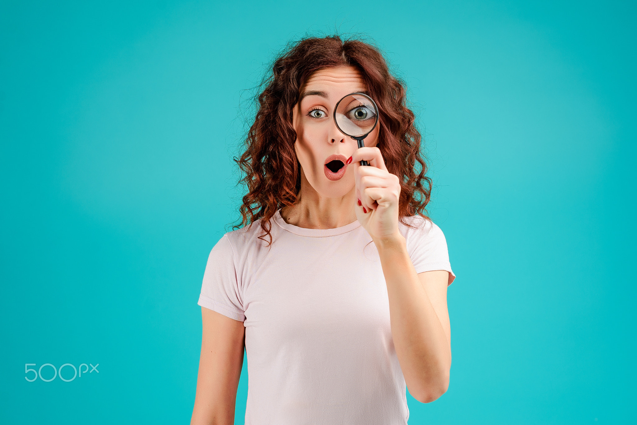 Young woman with curly hair isolated over bright colorful background